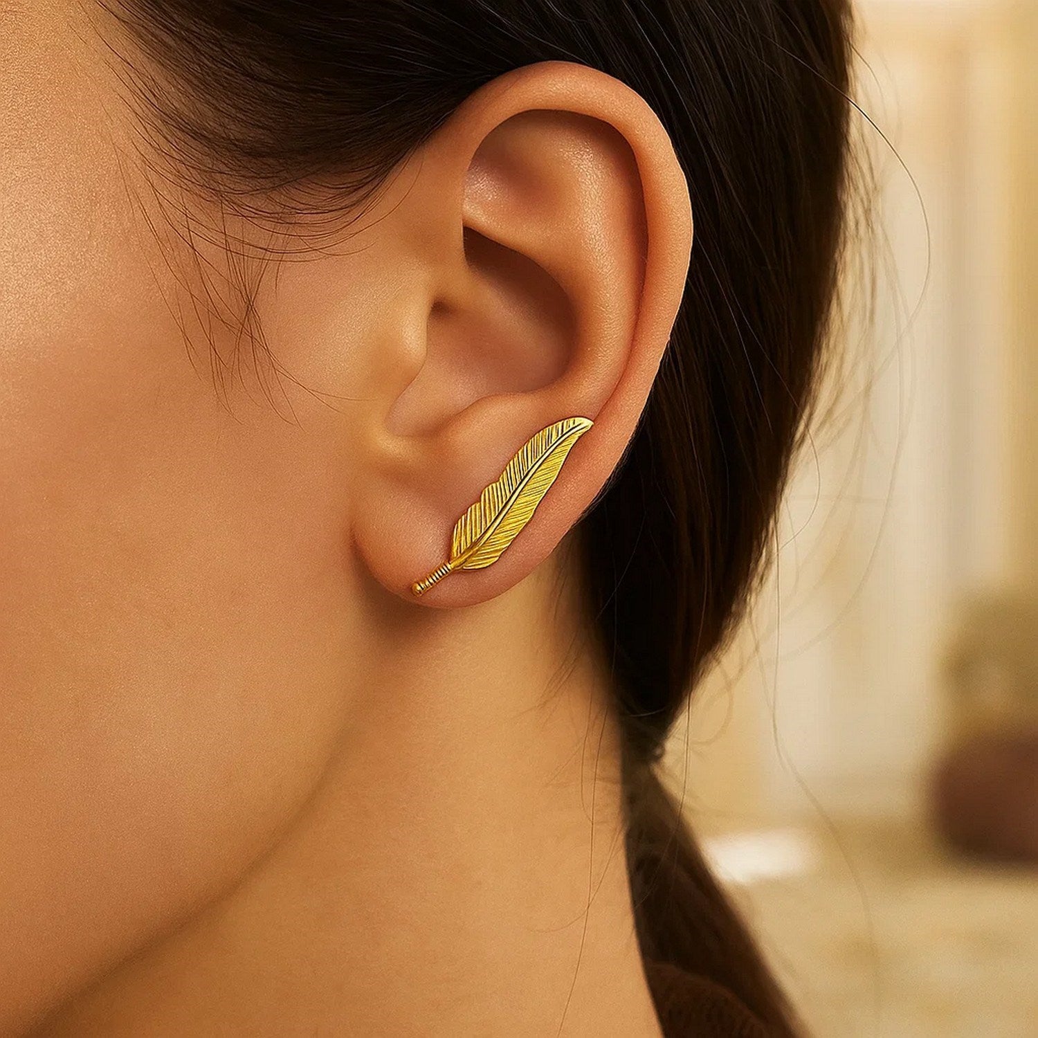14k yellow gold textured feather climber earrings showcasing modern luxury and exquisite craftsmanship.