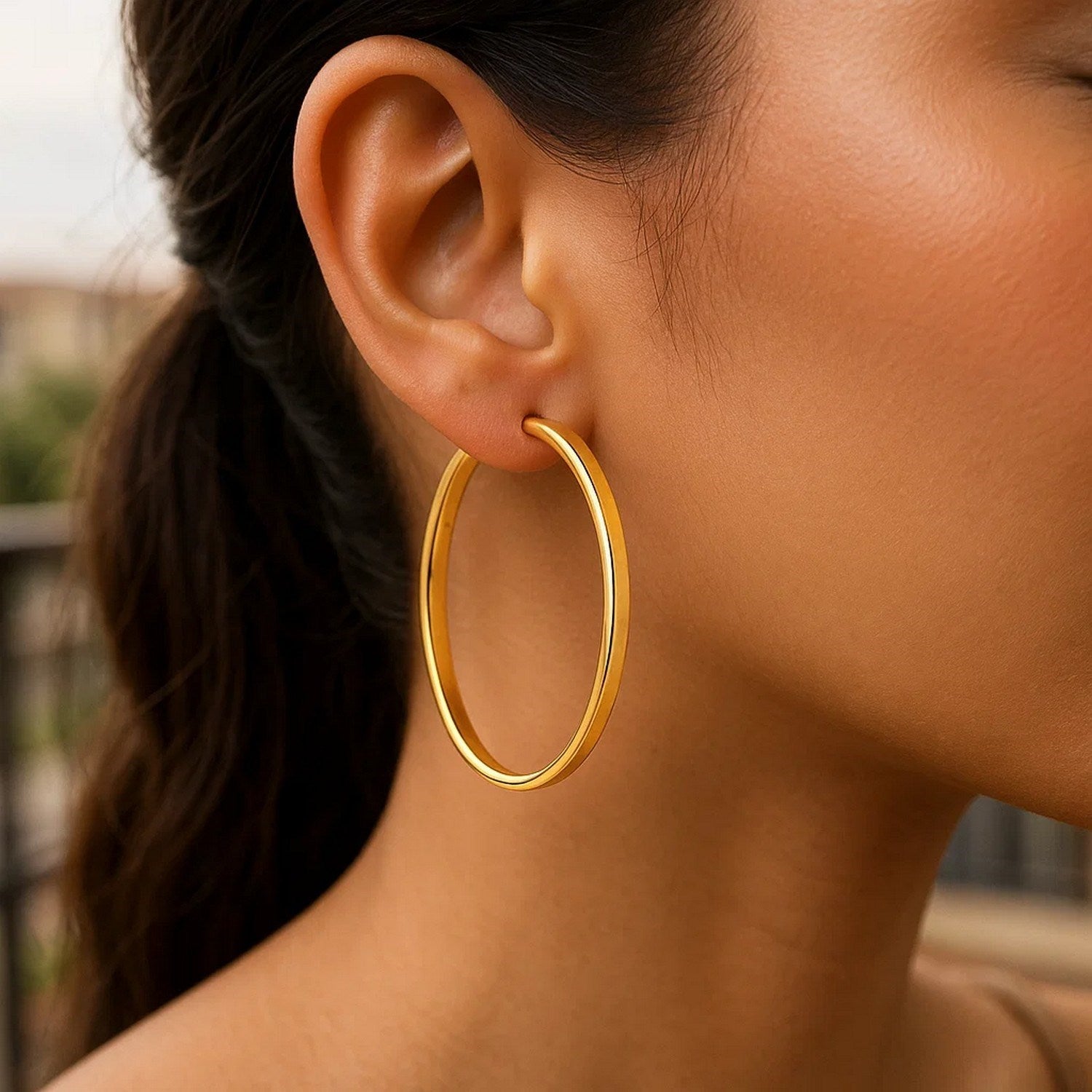 14k yellow gold polished hoop earrings with a sleek modern design, perfect for elegant everyday wear.