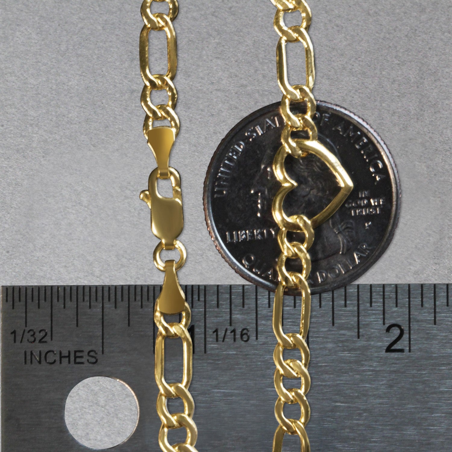 14k yellow gold Figaro chain bracelet with heart detail, contemporary design, 7-inch length, 4.50 mm links.