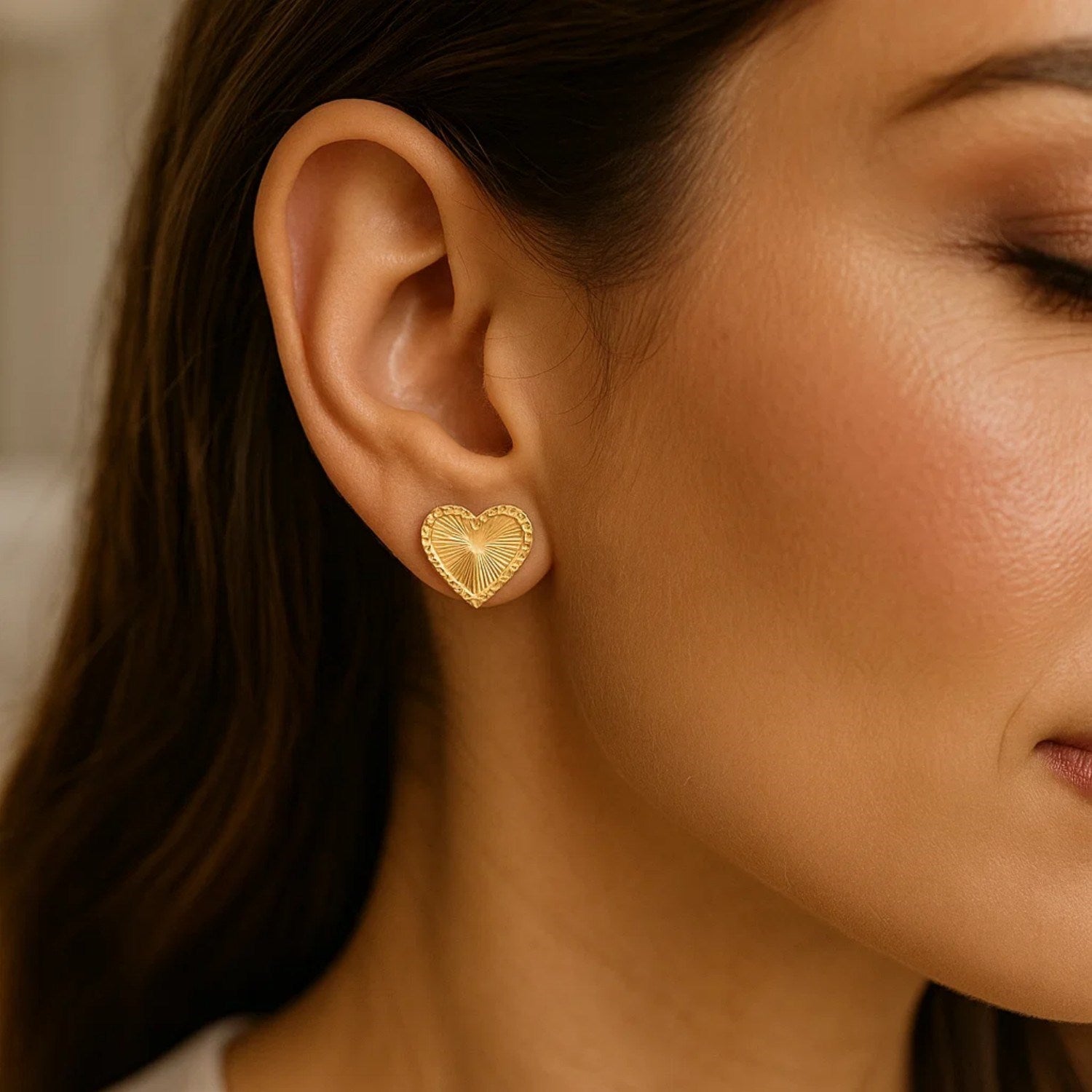 14k yellow gold modern stud earrings featuring a radiant heart design, perfect for elegant everyday wear.