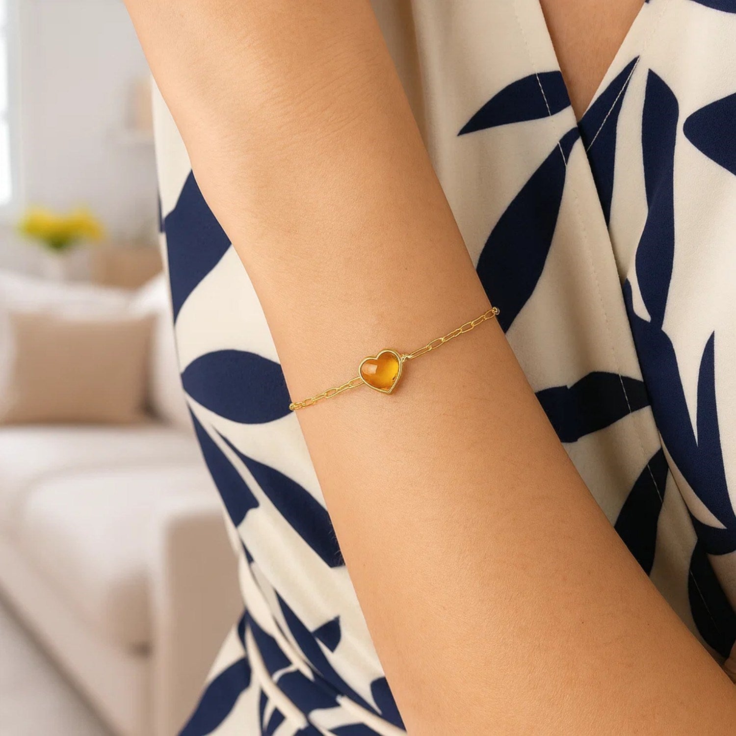 14k yellow gold bracelet featuring a heart-shaped citrine in a refined bezel setting, perfect for elegant occasions.