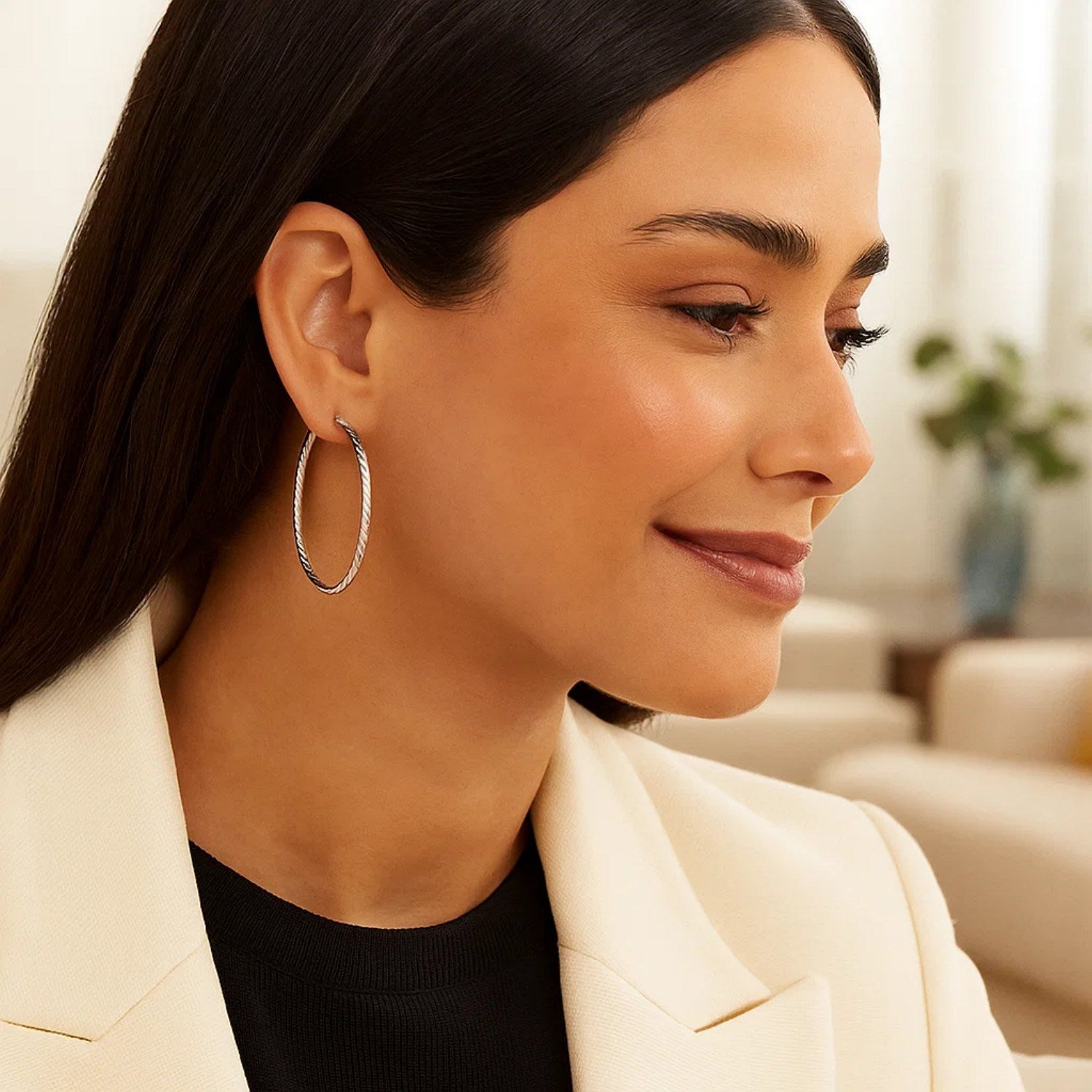 Sterling silver textured hoop earrings with an elegant twist design, perfect for sophisticated occasions.