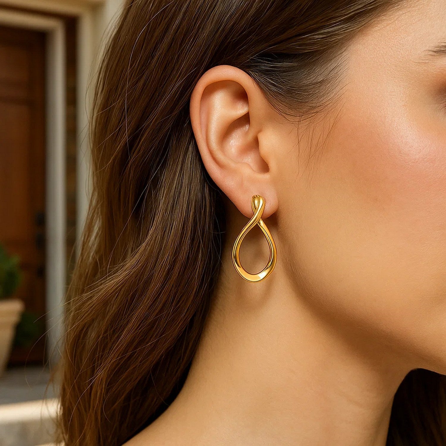 Elegant 14k yellow gold polished tear drop earrings showcasing a refined drop design for a luxurious touch.