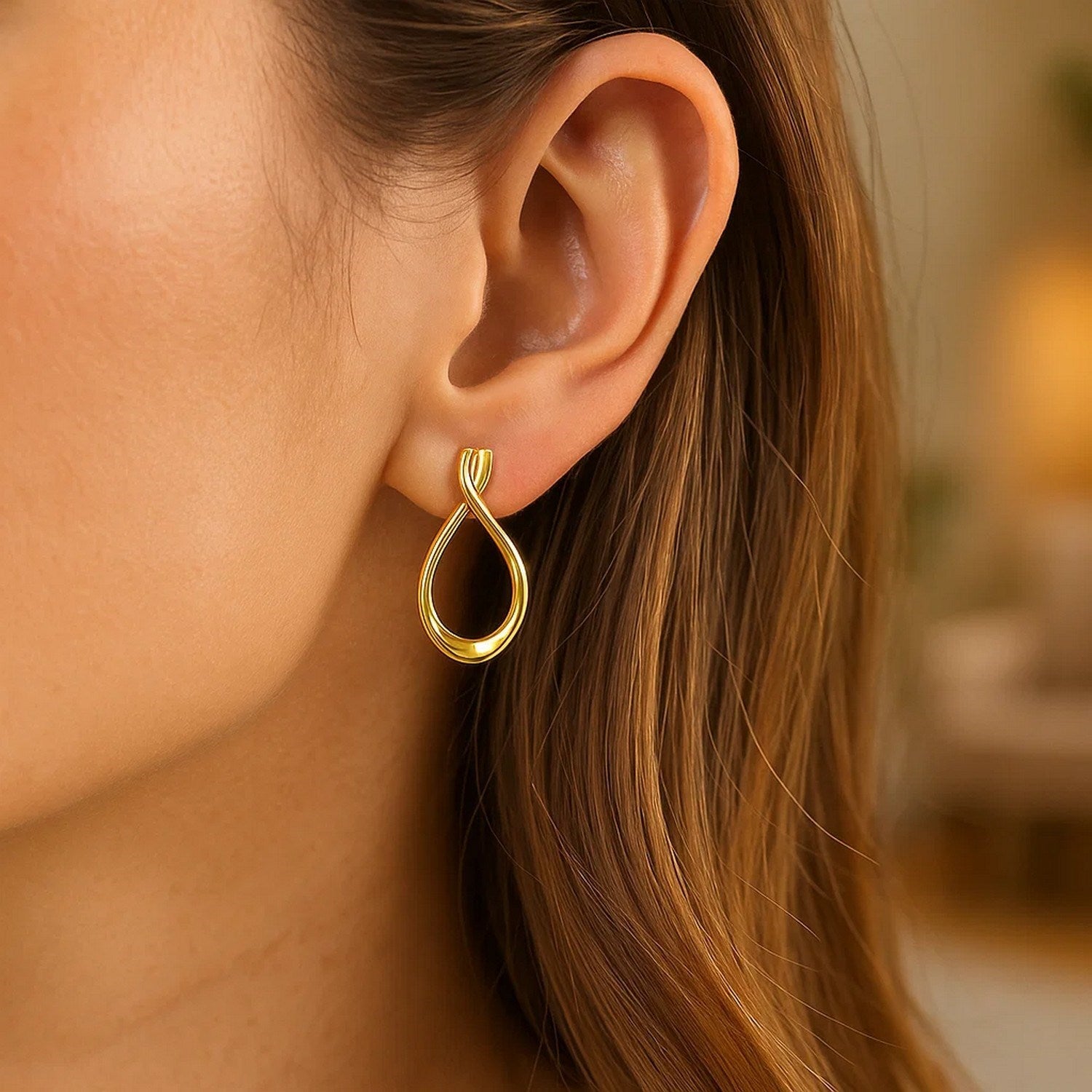 Elegant 14k yellow gold polished drop earrings showcasing a refined teardrop design for a luxurious touch.