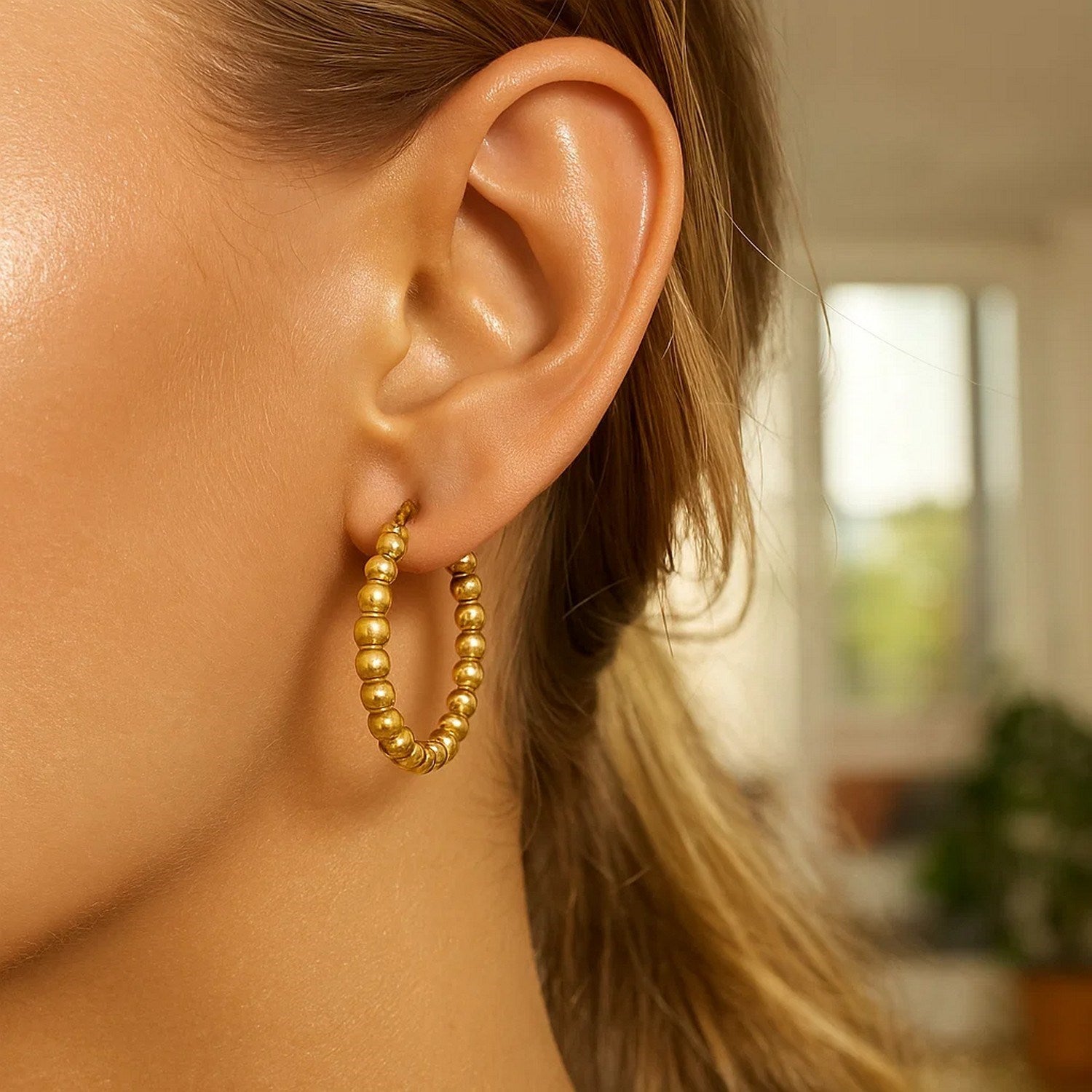 14k yellow gold textured polished hoop earrings showcasing modern elegance and refined craftsmanship.