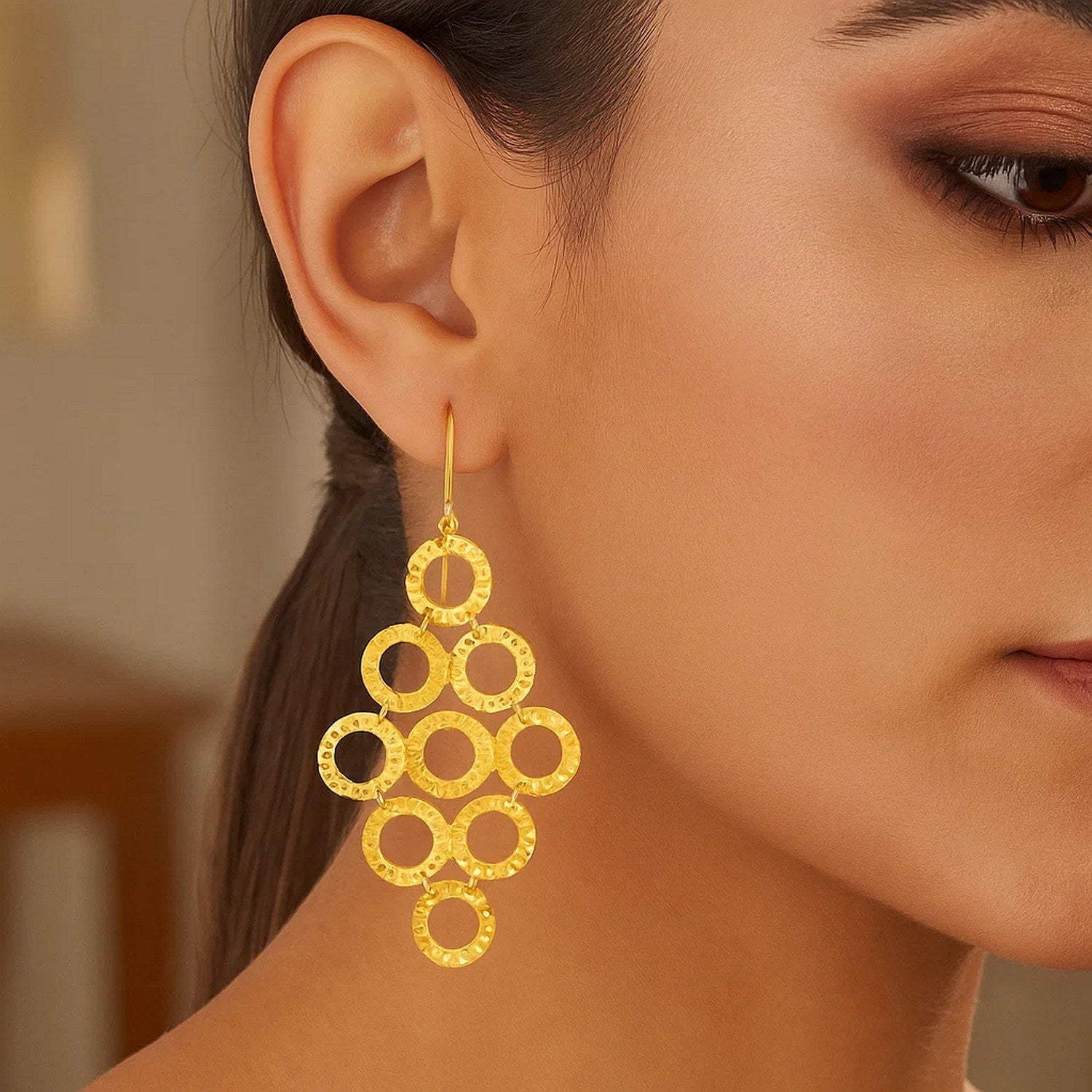 14k yellow gold textured open circle earrings, elegantly designed for a luxurious statement in any collection.