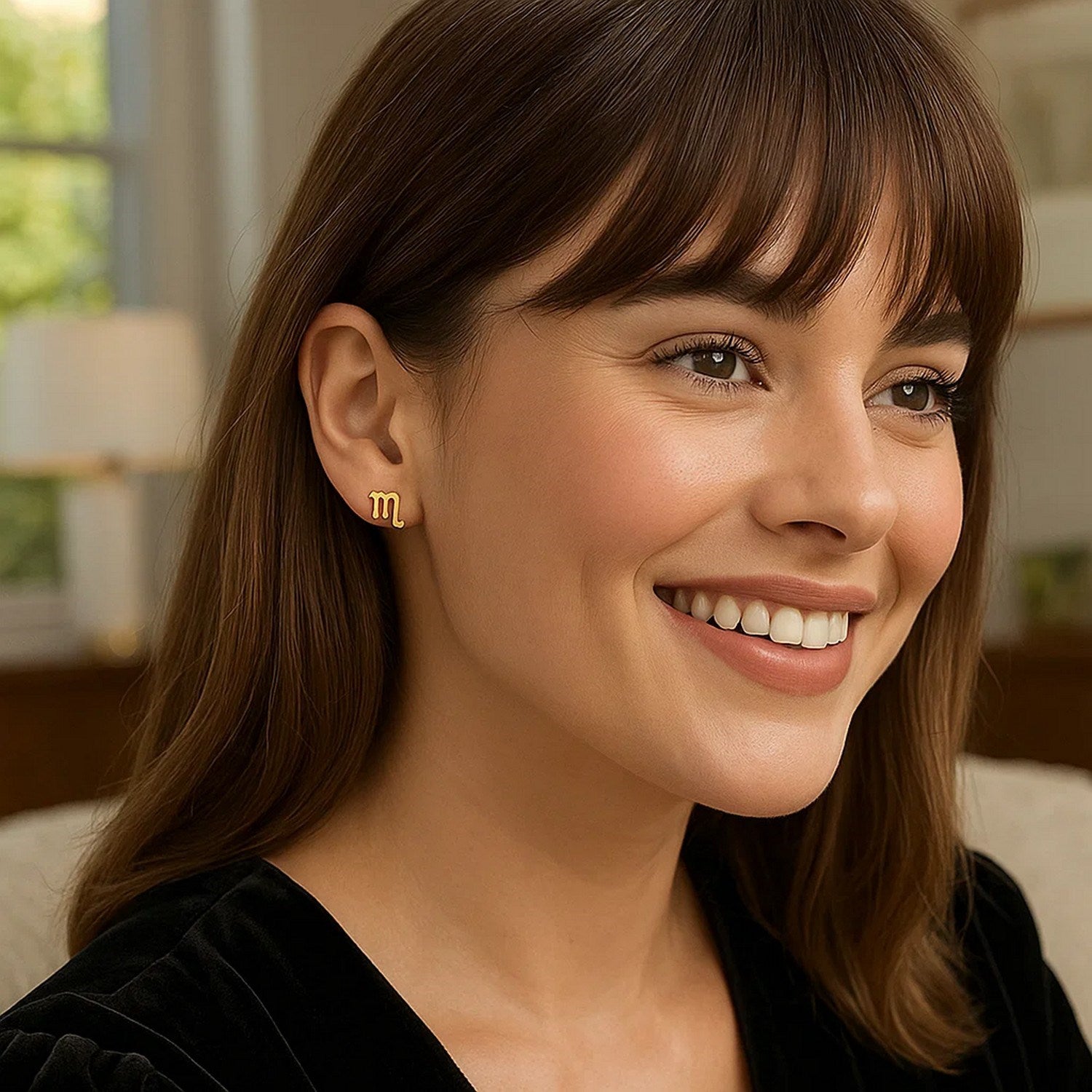 Contemporary 14k yellow gold Scorpio stud earrings with intricate detailing and a polished finish.