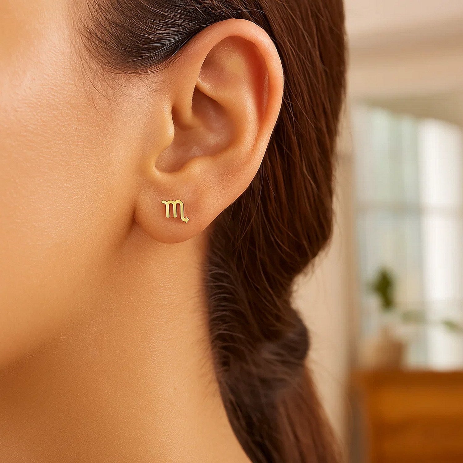 Contemporary 14k yellow gold Scorpio stud earrings with intricate detailing, perfect for a luxurious statement.