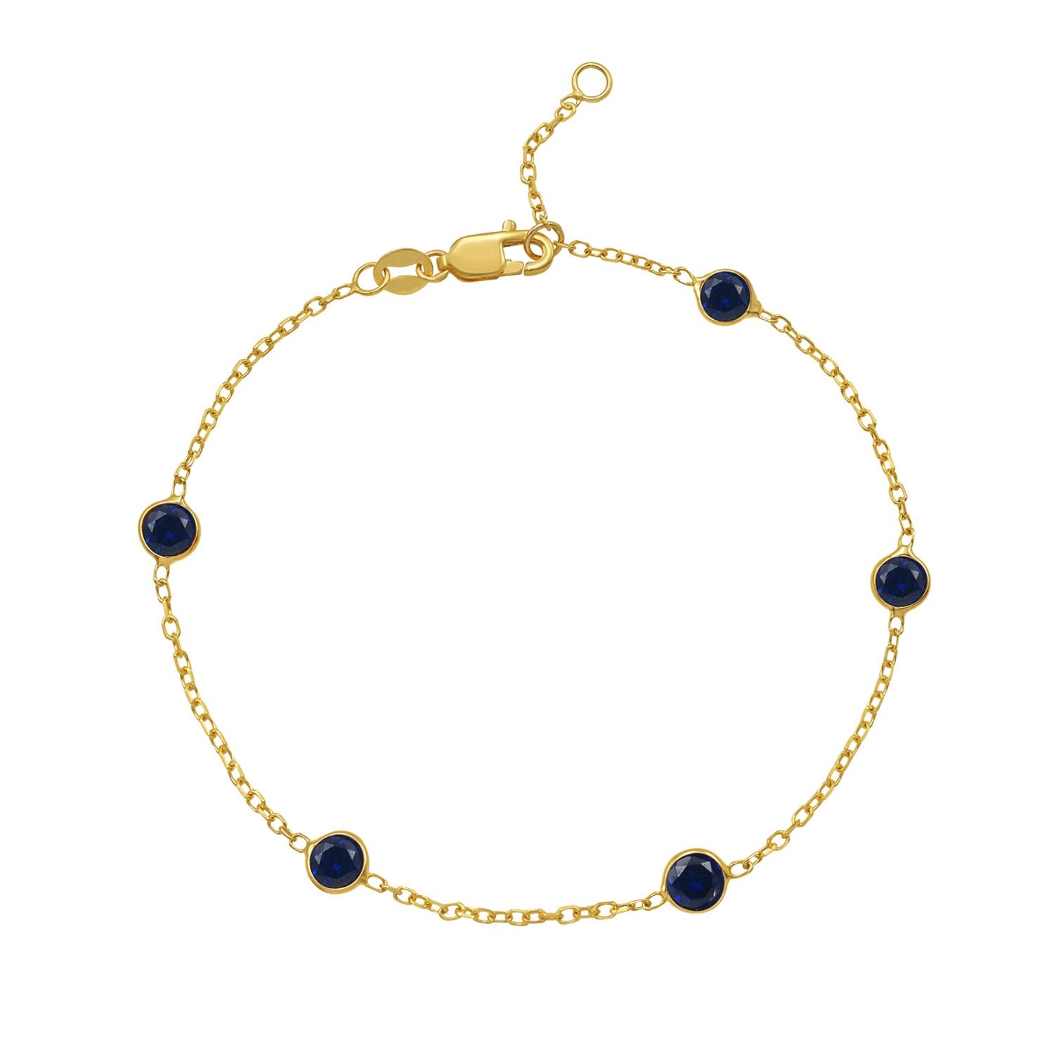 Elegant 14k yellow gold bracelet featuring blue sapphire stations on a delicate chain design.