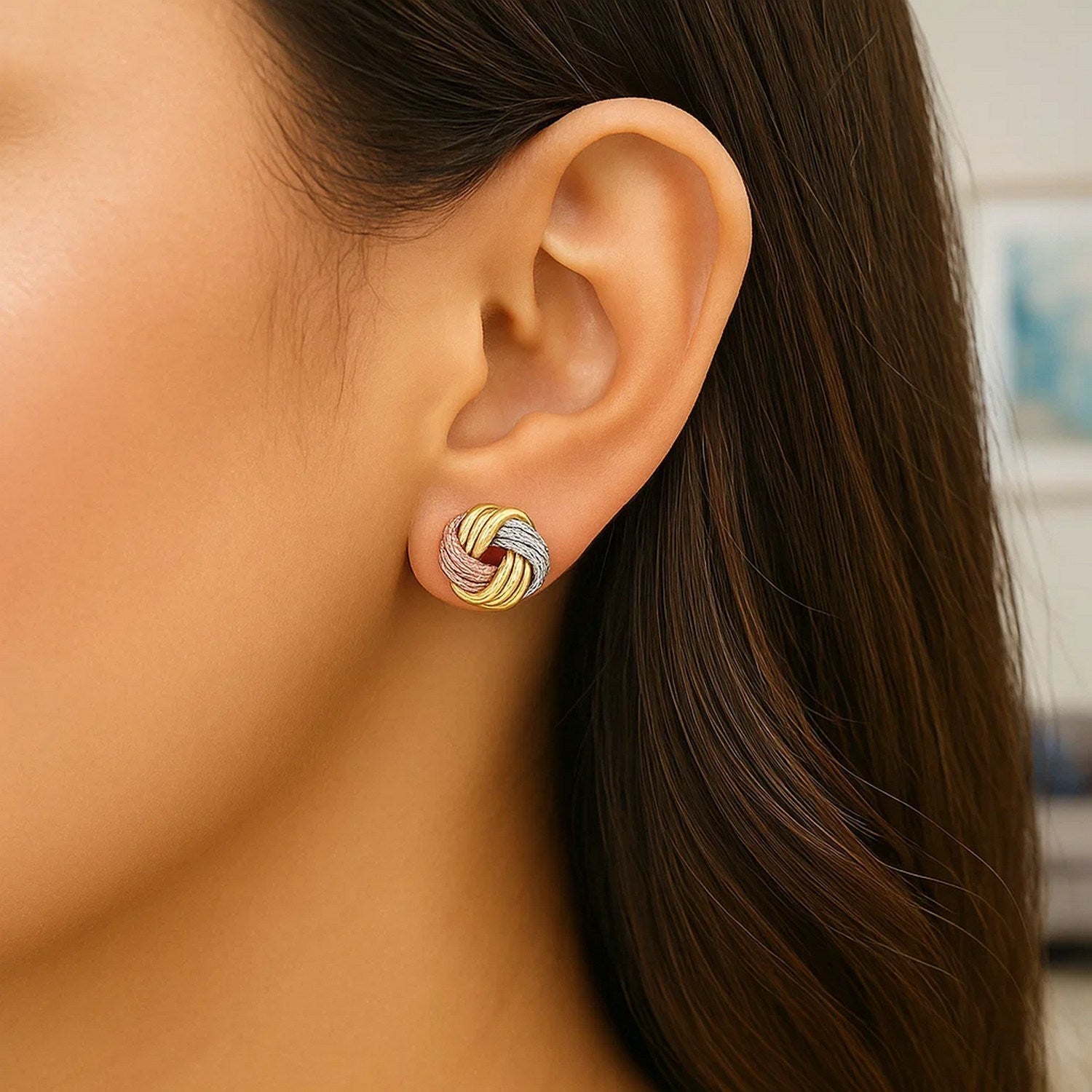 14k tri-color gold love knot post earrings showcasing a classic design with luxurious elegance and timeless appeal.