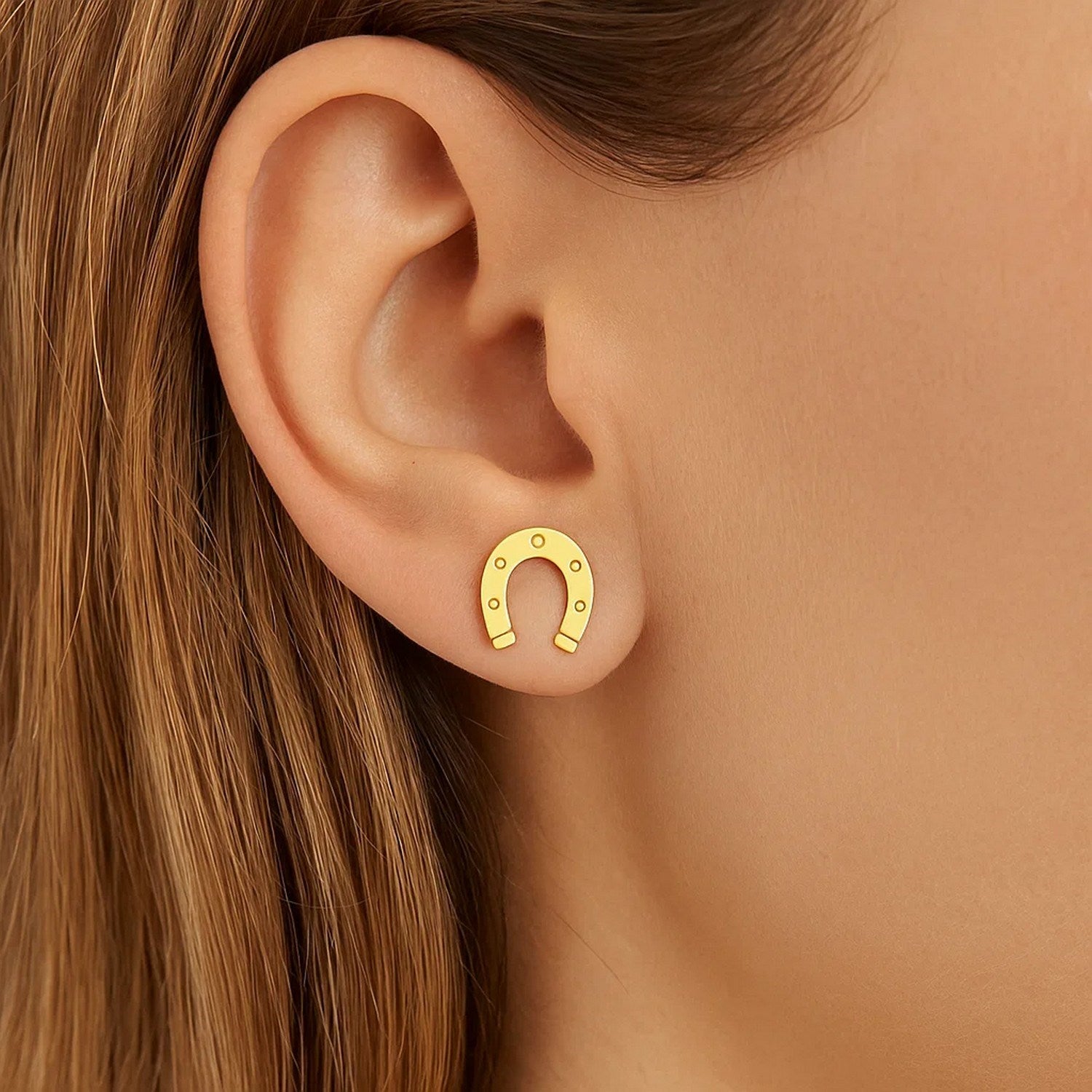 14k yellow gold textured horseshoe stud earrings, showcasing modern elegance and unique design.