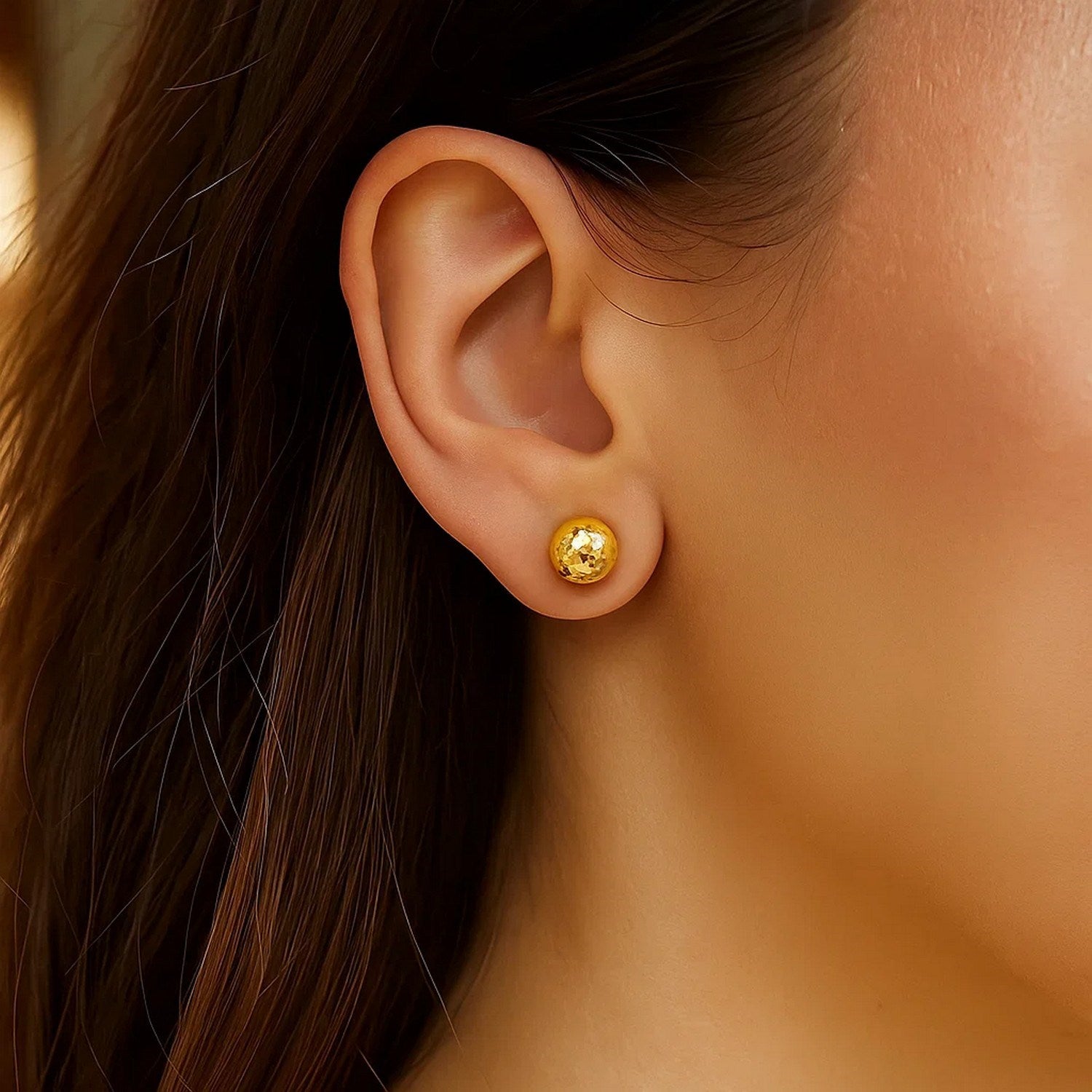 14k yellow gold textured ball stud earrings showcasing a classic design with elegant simplicity and timeless appeal.