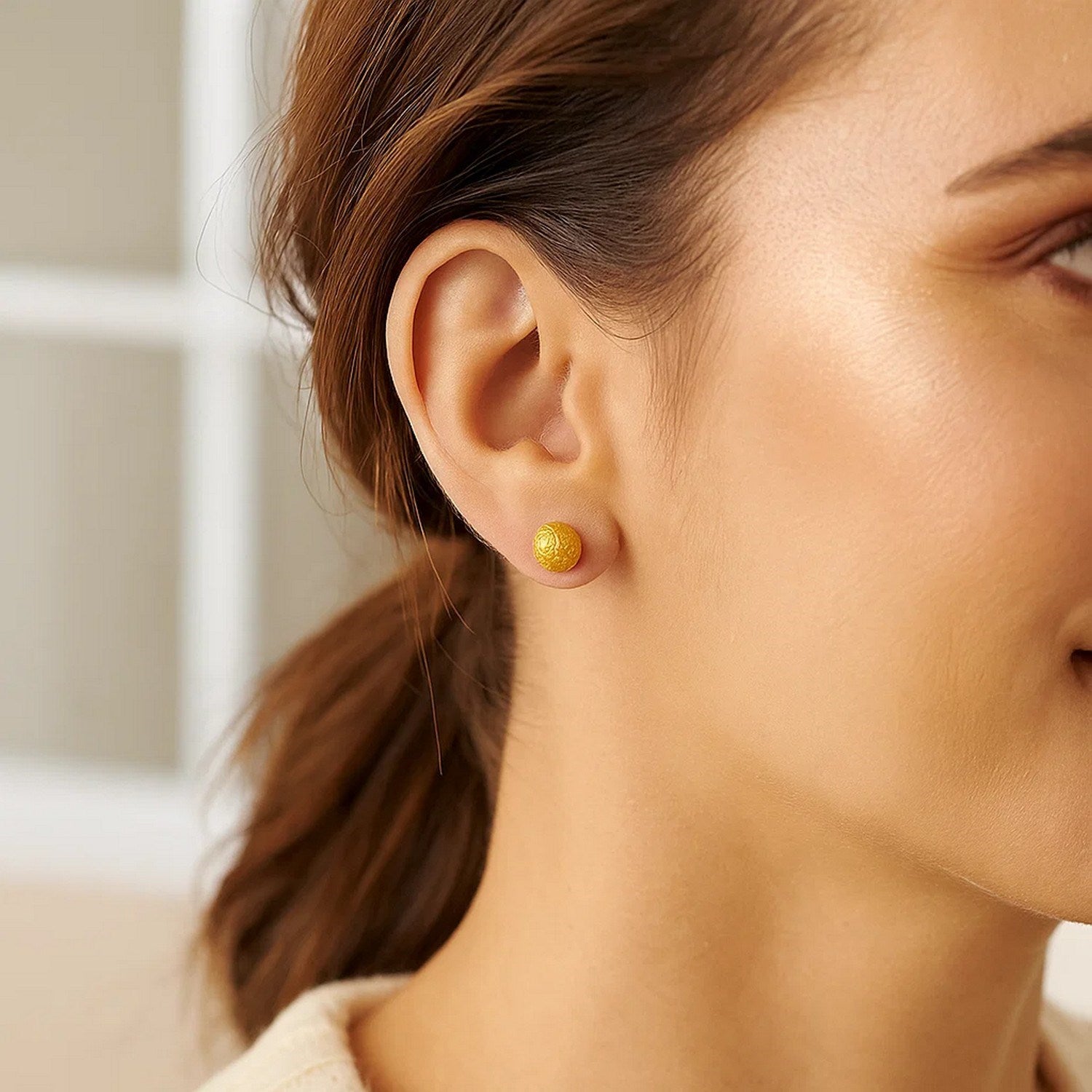 14k yellow gold textured ball stud earrings, showcasing a classic design with elegant craftsmanship and timeless appeal.