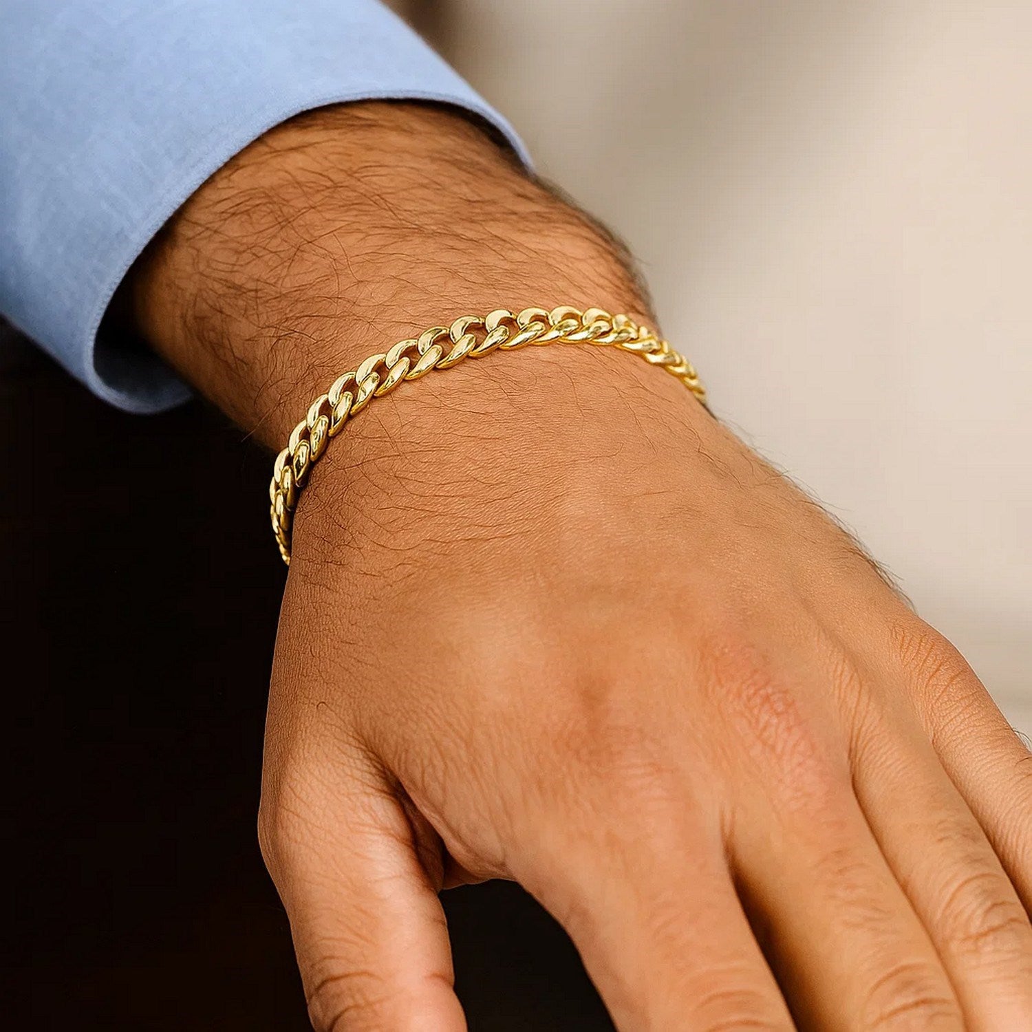 Elegant 14k yellow gold semi-solid Miami Cuban bracelet featuring a classic link design, perfect for luxury styling.