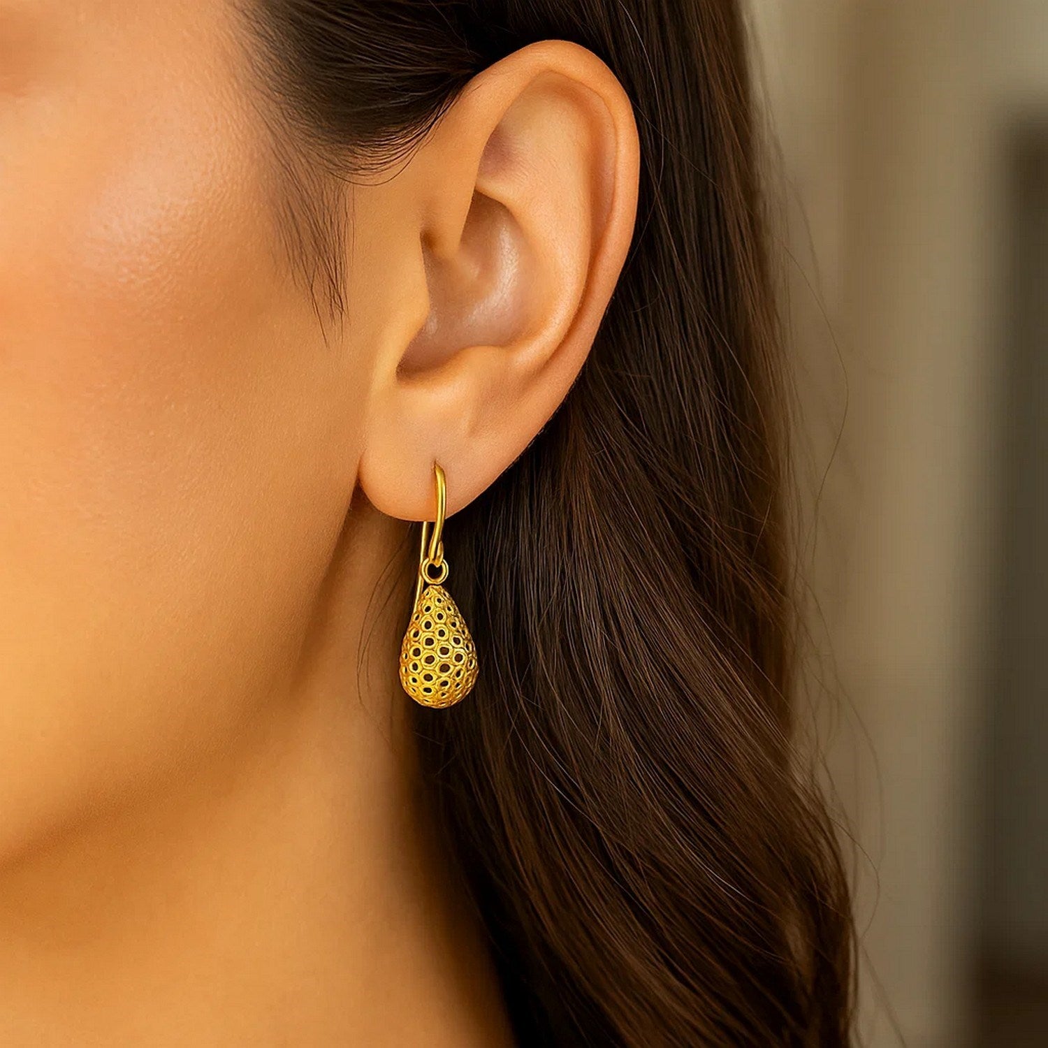 14k yellow gold honeycomb textured teardrop earrings with contemporary drop design, perfect for elegant occasions.
