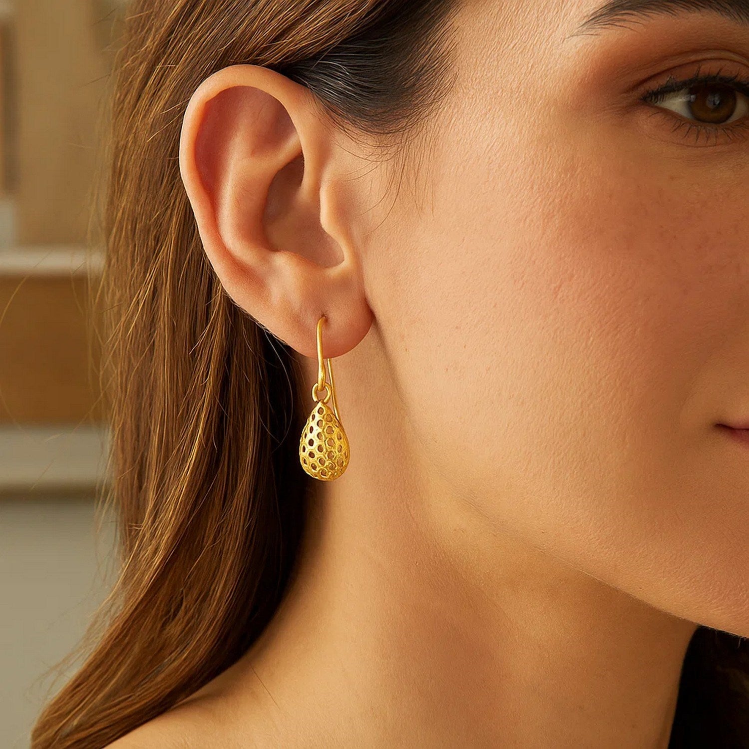 14k yellow gold honeycomb textured teardrop earrings with contemporary design and elegant drop silhouette.