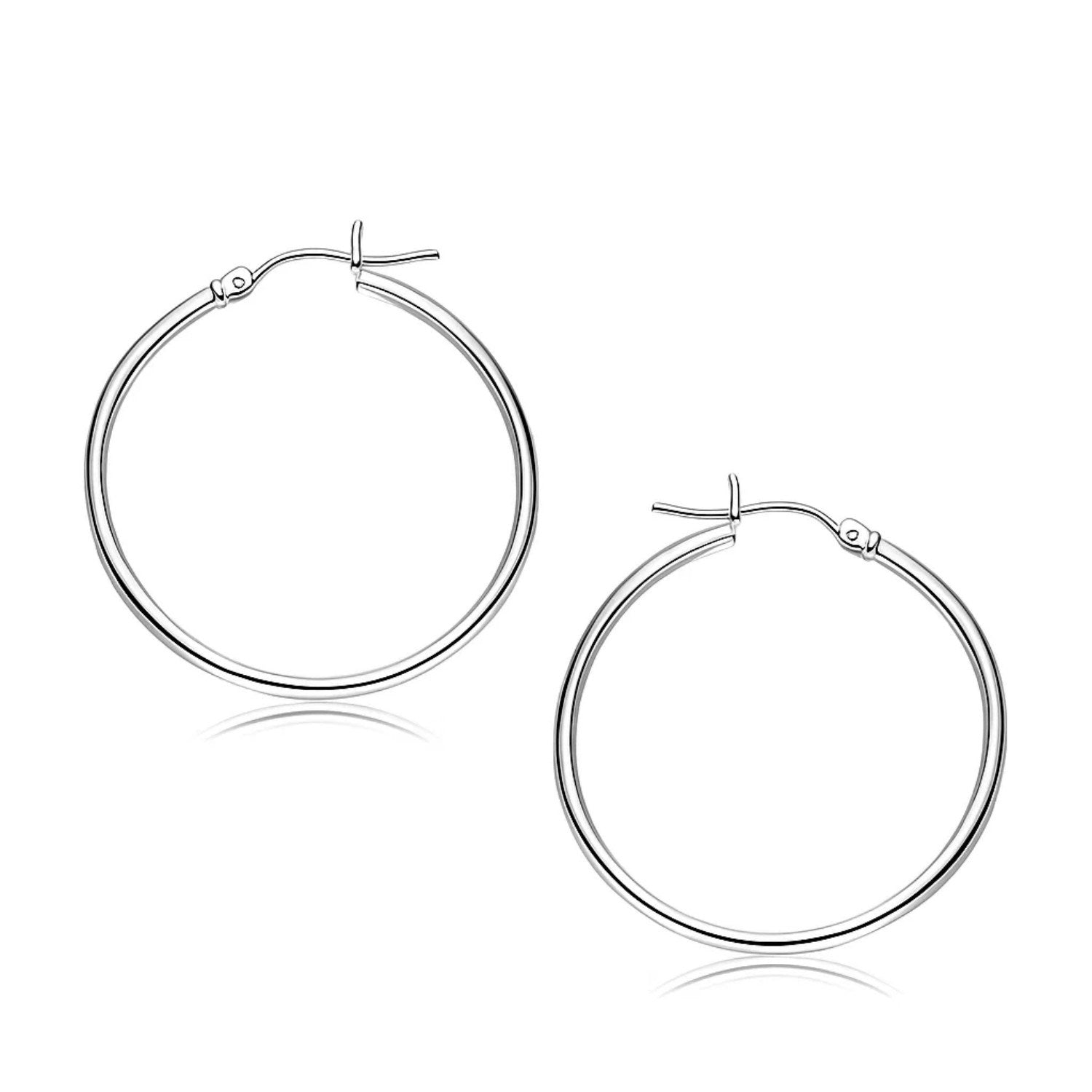 14k white gold polished hoop earrings with a timeless design, perfect for elegant everyday wear.