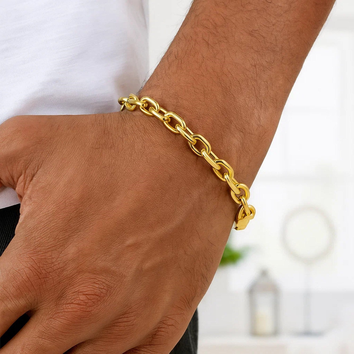 14k yellow gold French cable chain bracelet, elegantly designed with round links for a timeless luxury appeal.