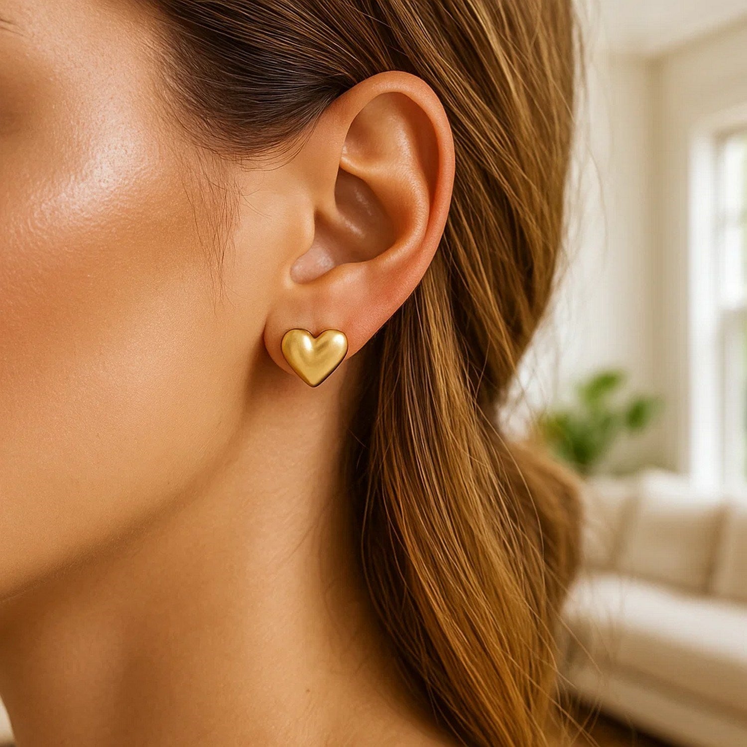 14k yellow gold modern puffed heart stud earrings with a polished finish, perfect for elegant everyday wear.