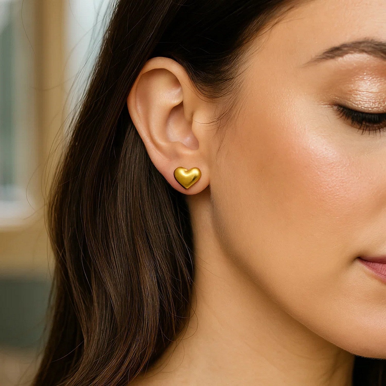 14K yellow gold modern puffed heart stud earrings with a sleek design, perfect for elegant everyday wear.