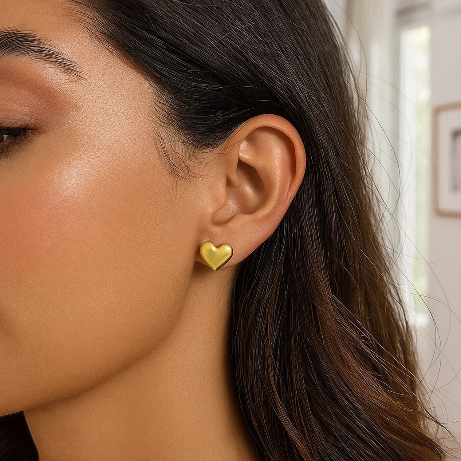 14k yellow gold modern puffed heart stud earrings, elegantly designed for a luxurious touch.