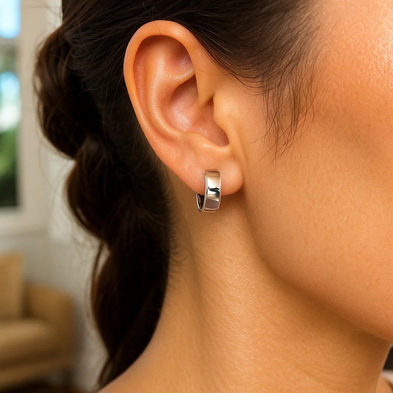 Elegant 14k white gold snuggable hoop earrings, showcasing a refined design perfect for any occasion.