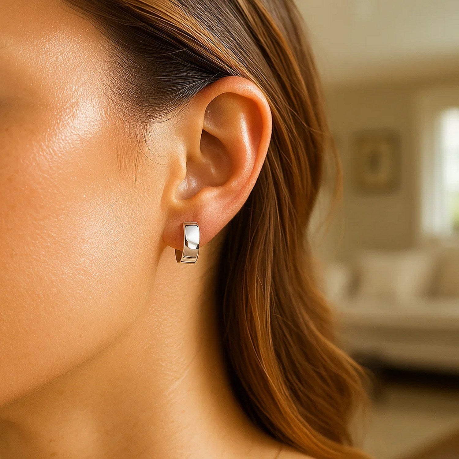 Elegant 14k white gold snuggable hoop earrings showcasing a sleek, refined design for timeless luxury.