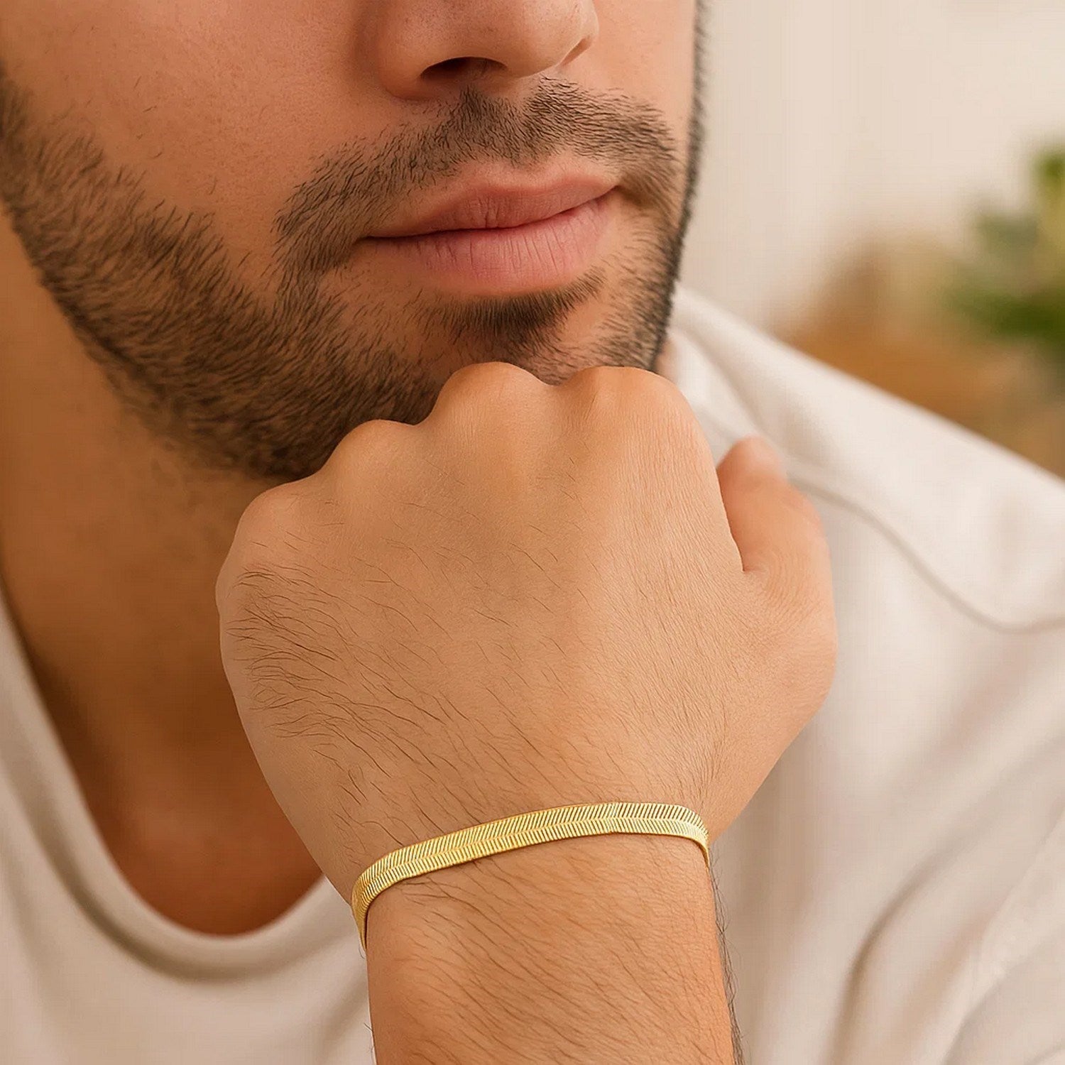14k yellow gold modern herringbone bracelet featuring a flexible design and sleek stud chain detail.