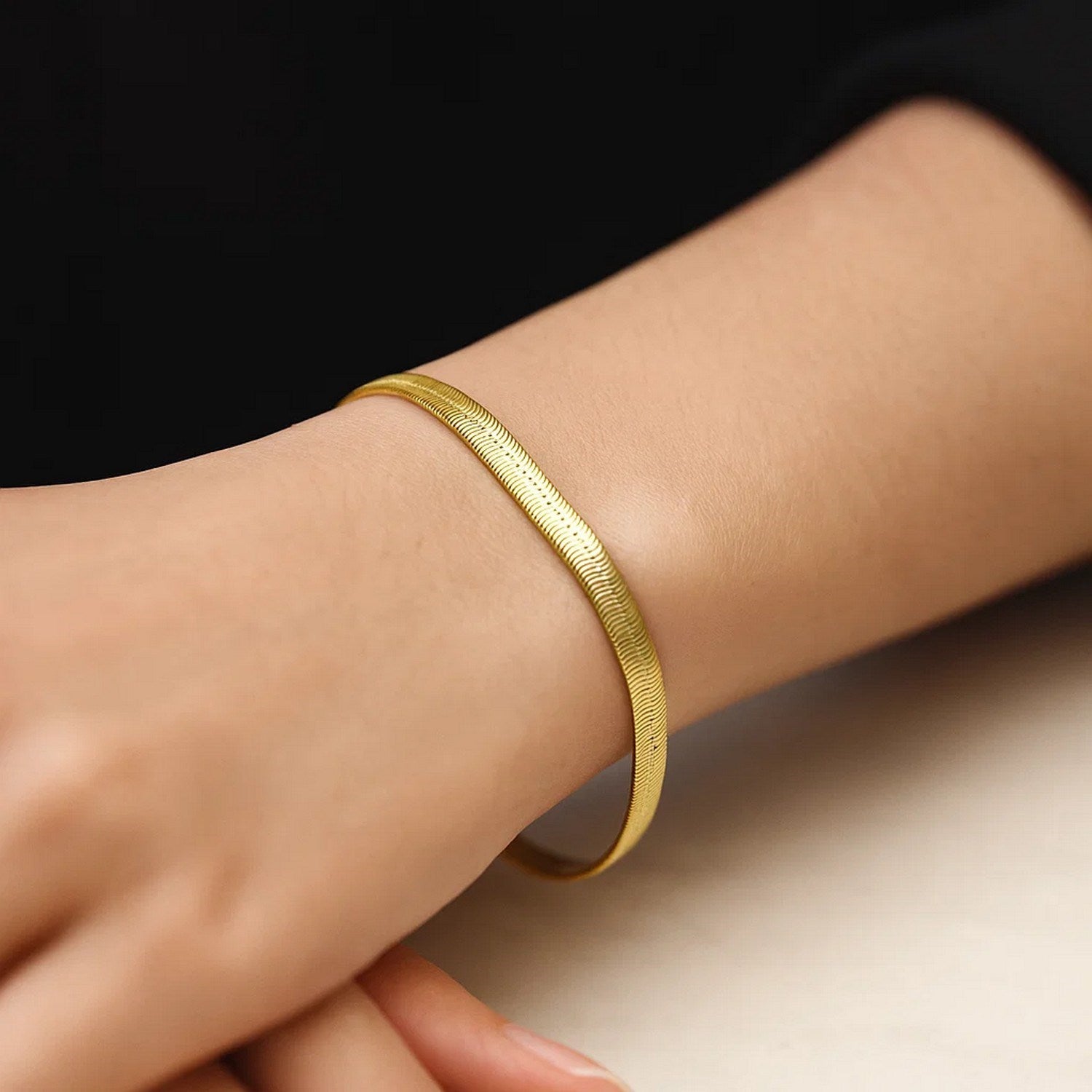 14k yellow gold modern herringbone bracelet with a sleek super flex design, showcasing exquisite craftsmanship.