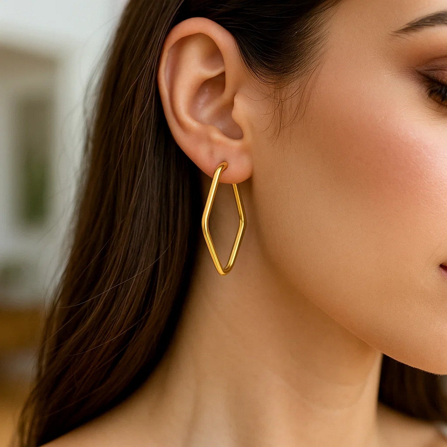 14k yellow gold modern endless marquise hoop earrings showcasing elegant craftsmanship and timeless design.