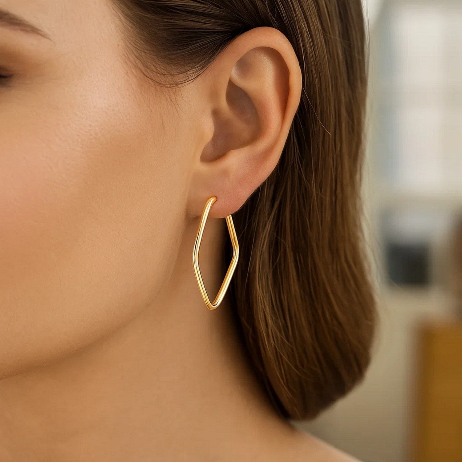 14k yellow gold modern endless marquise hoop earrings with elegant design and luxurious shine.