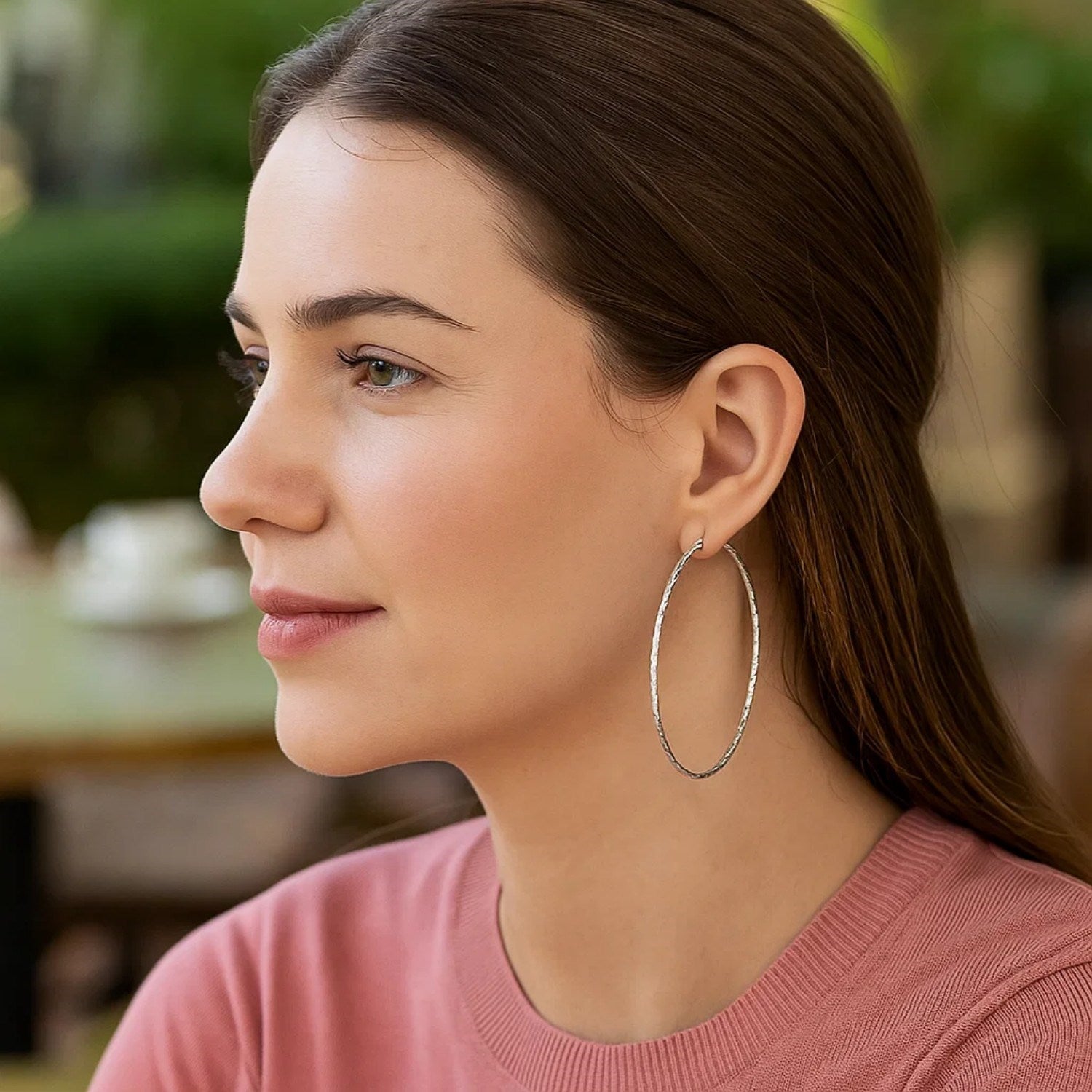 Sterling silver textured large round hoop earrings showcasing modern elegance and refined craftsmanship.