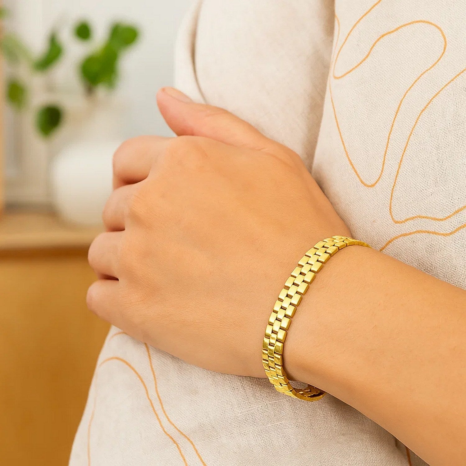 14k yellow gold small cobblestone link bracelet with modern design and elegant stud detailing.