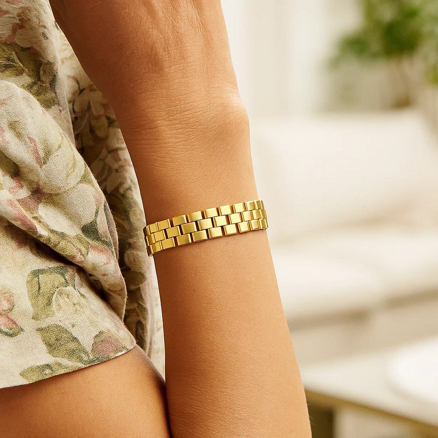 14k yellow gold small cobblestone link bracelet with modern design and elegant stud details.