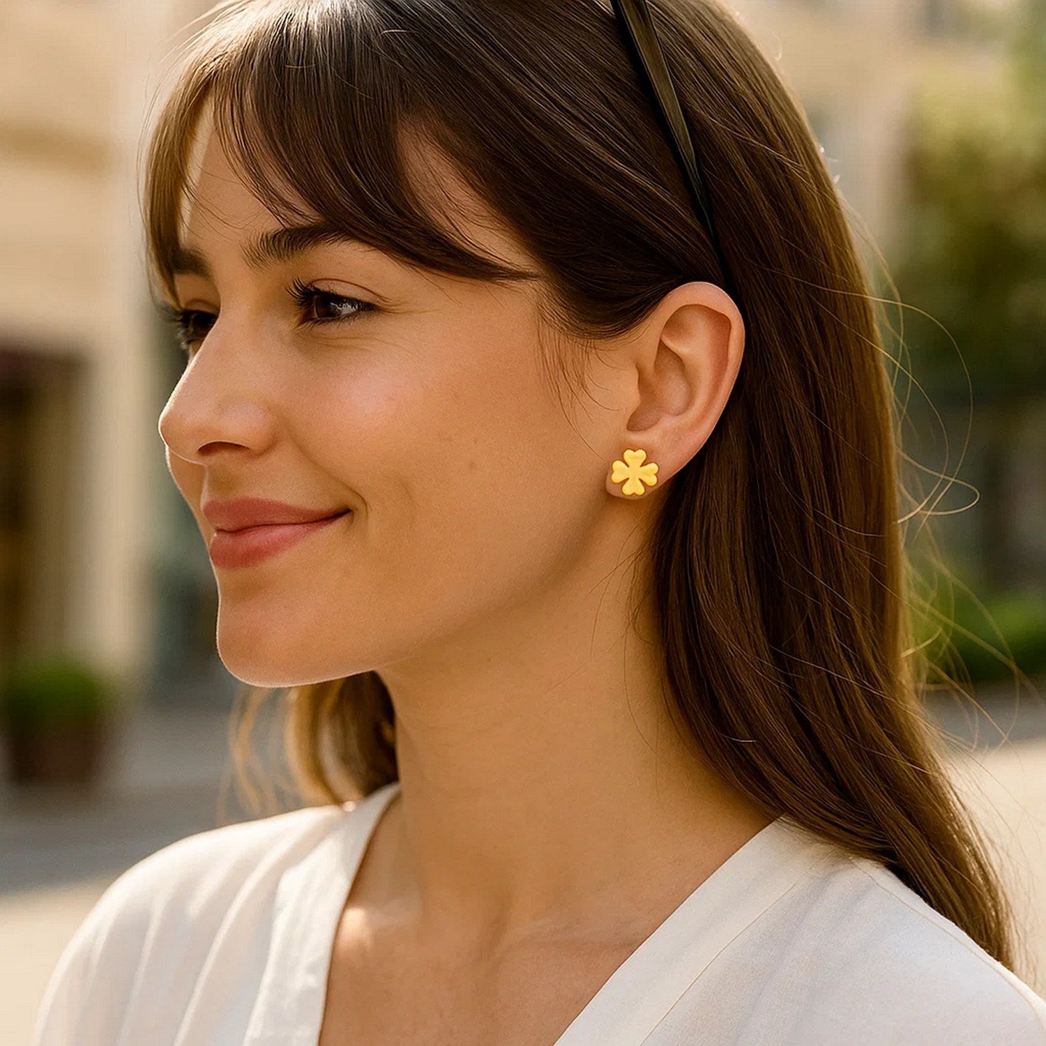 Elegant 14k yellow gold four leaf clover stud earrings, showcasing a timeless design for sophisticated style.