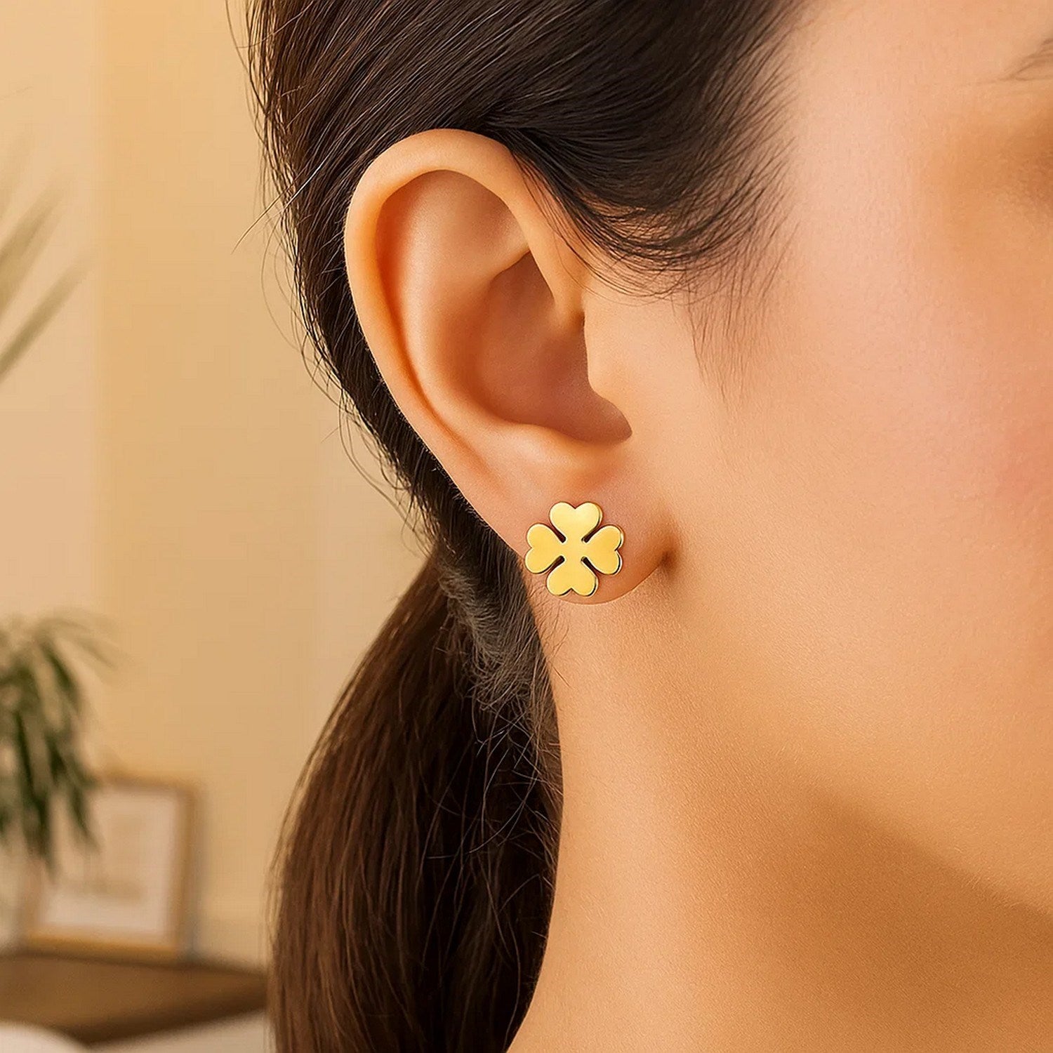 Elegant 14k yellow gold four leaf clover stud earrings, showcasing a timeless design for luxury jewelry enthusiasts.