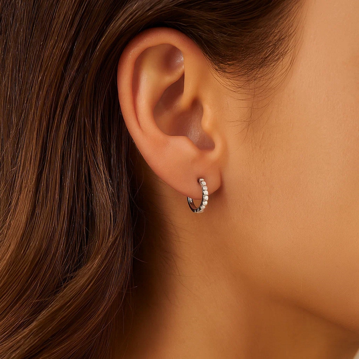 14k white gold textured round hoop earrings showcasing contemporary elegance and refined craftsmanship.