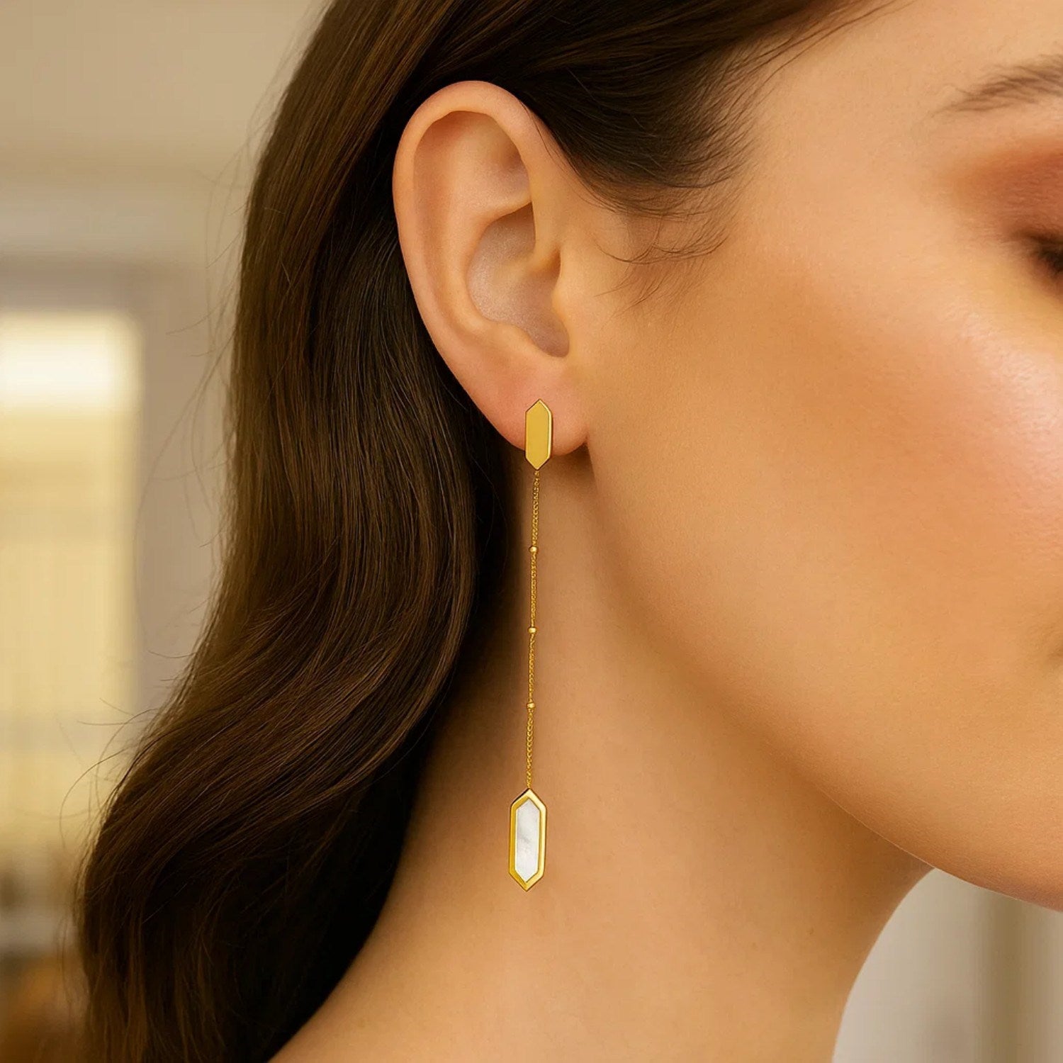 14K yellow gold drop earrings featuring lustrous mother of pearl and elegant chain design for a modern touch.