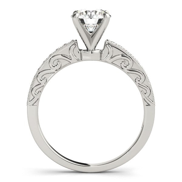 Antique style 14k white gold engagement ring featuring a dazzling diamond in an intricate vintage setting.