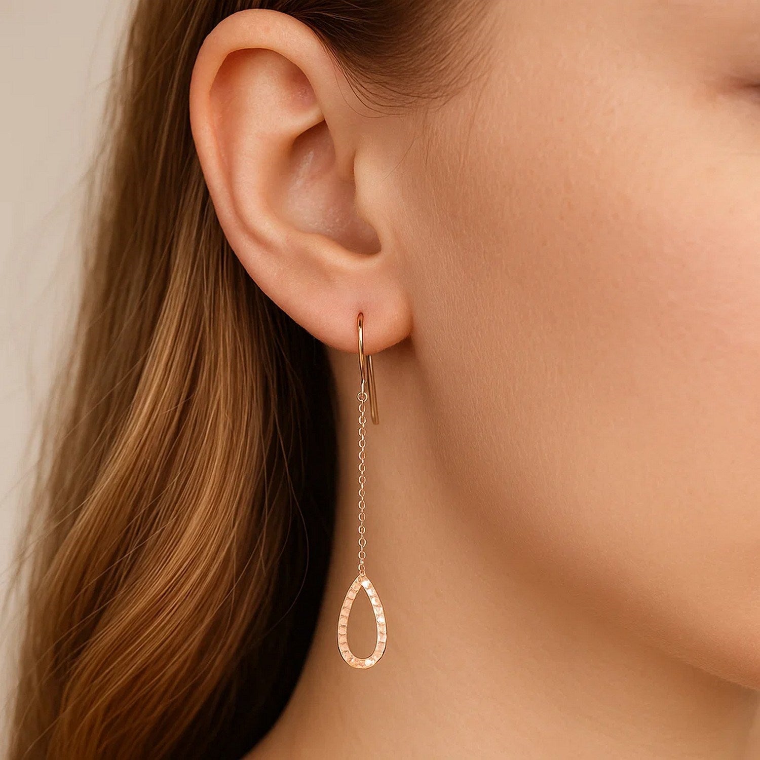 14k rose gold textured pear-shaped drop earrings with elegant chain design for a luxurious touch.