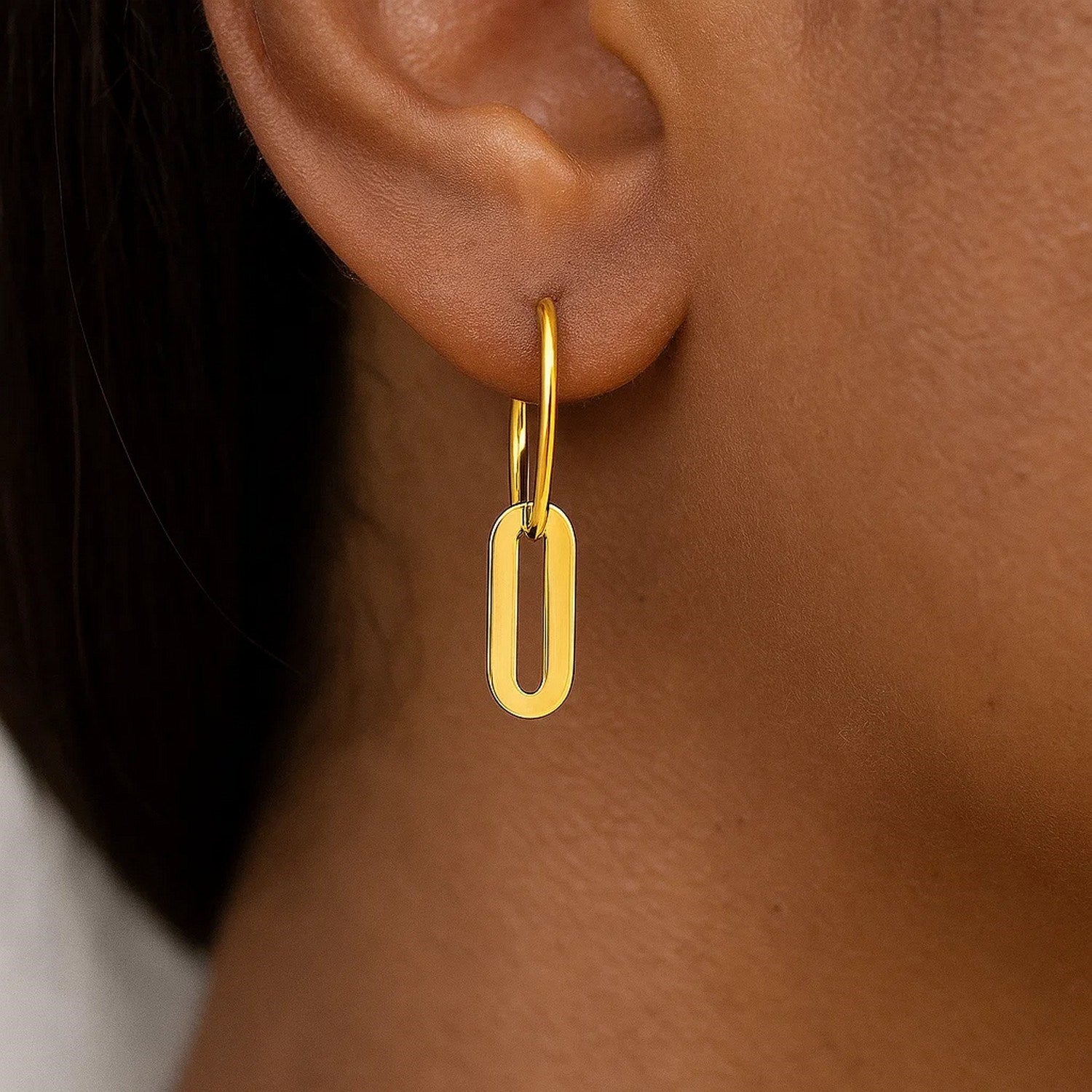14k yellow gold huggie hoop earrings featuring elegant paperclip link drops for a modern, luxurious look.