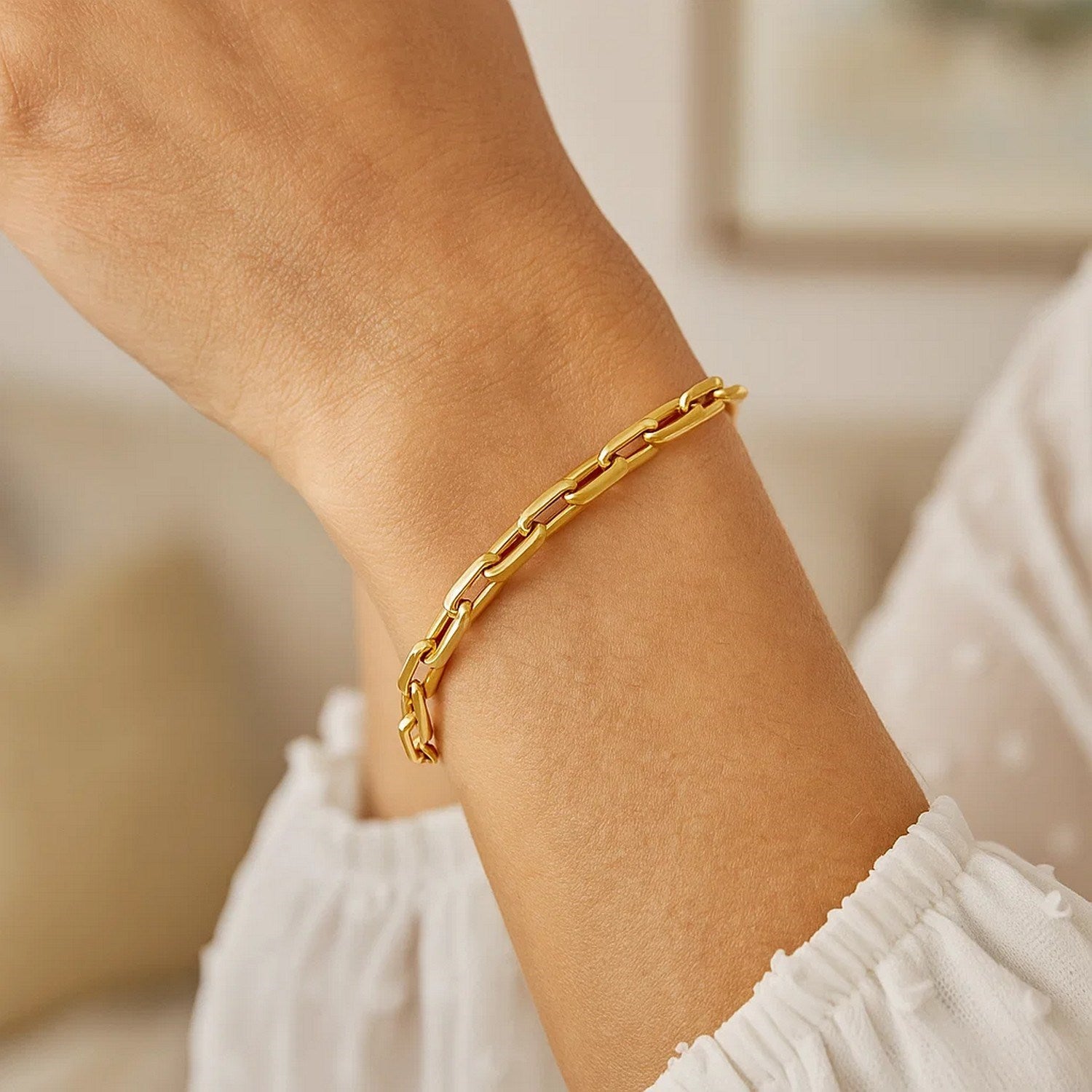14k yellow gold modern paperclip chain bracelet, 7 1/2 inches, featuring elegant link design and refined finish.