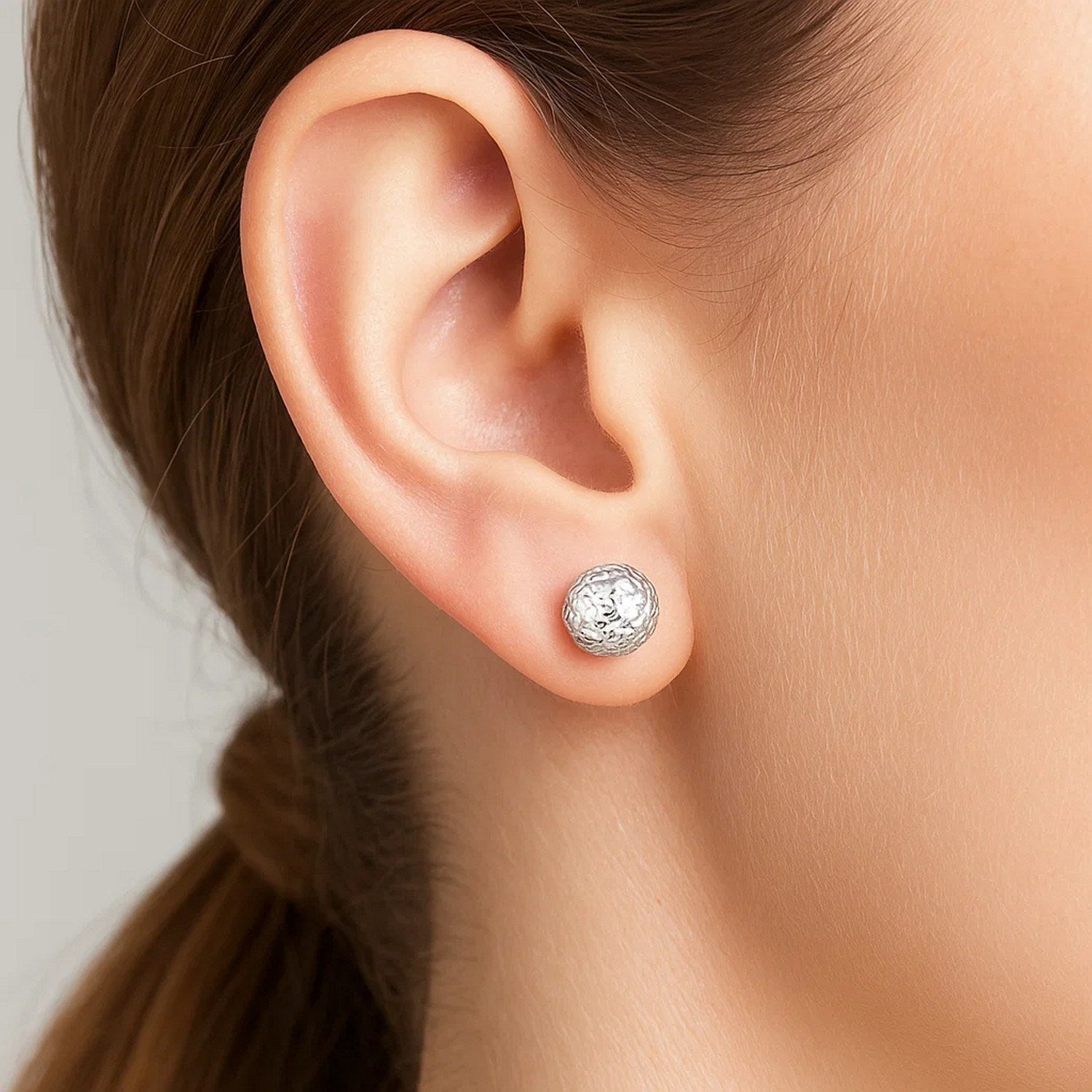 14k white gold textured ball stud earrings showcasing an elegant design for a refined look.