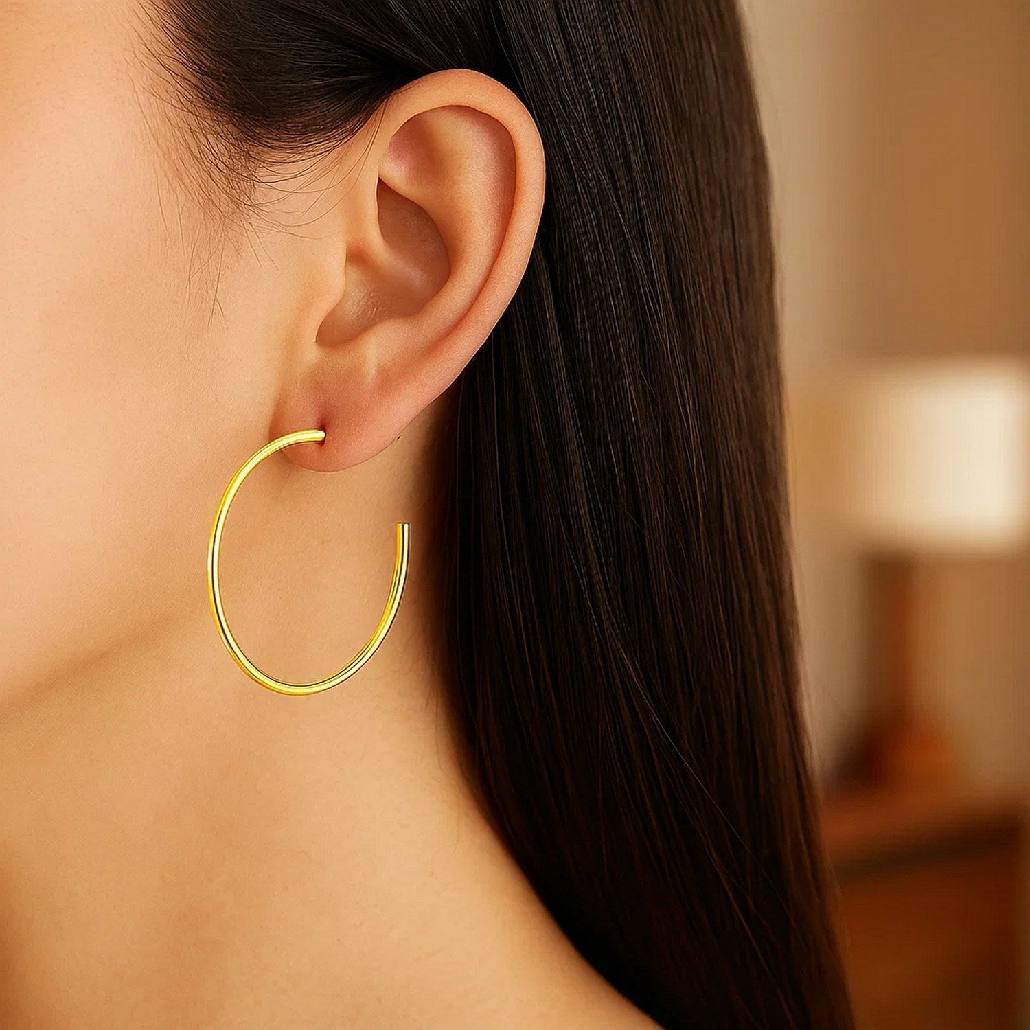 14k yellow gold polished hoop earrings featuring a sleek modern design, perfect for elegant everyday wear.