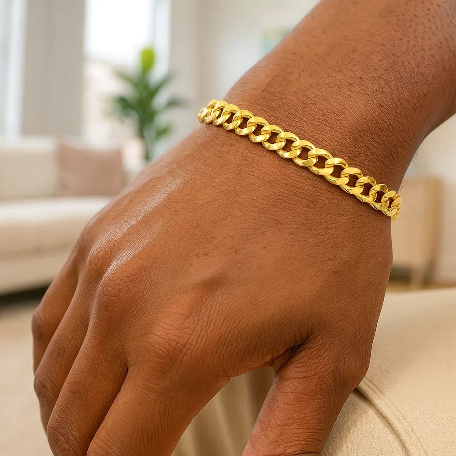 14k yellow gold semi-solid Miami Cuban bracelet with round links, showcasing contemporary elegance and luxury craftsmanship.