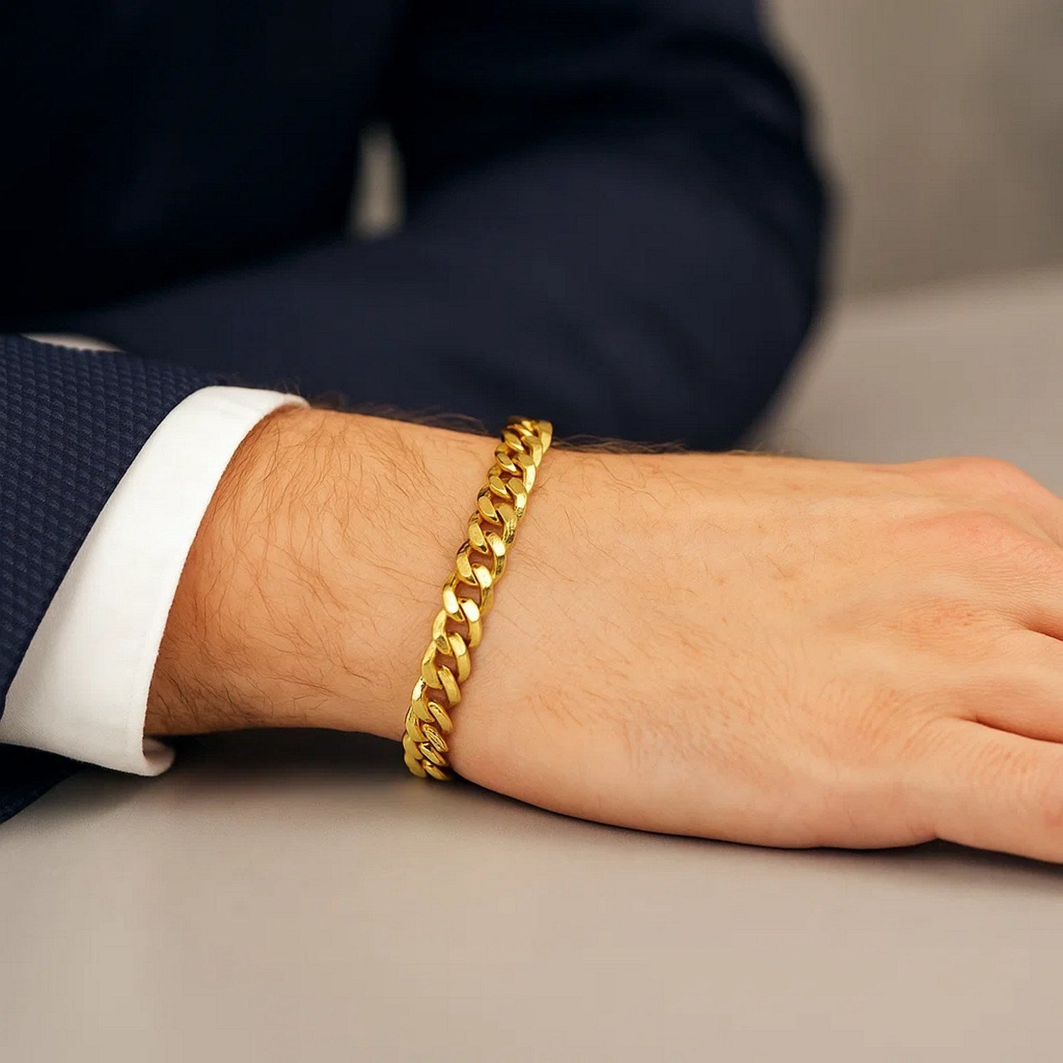 14k yellow gold semi-solid Miami Cuban bracelet with round links, showcasing contemporary elegance and luxurious craftsman...