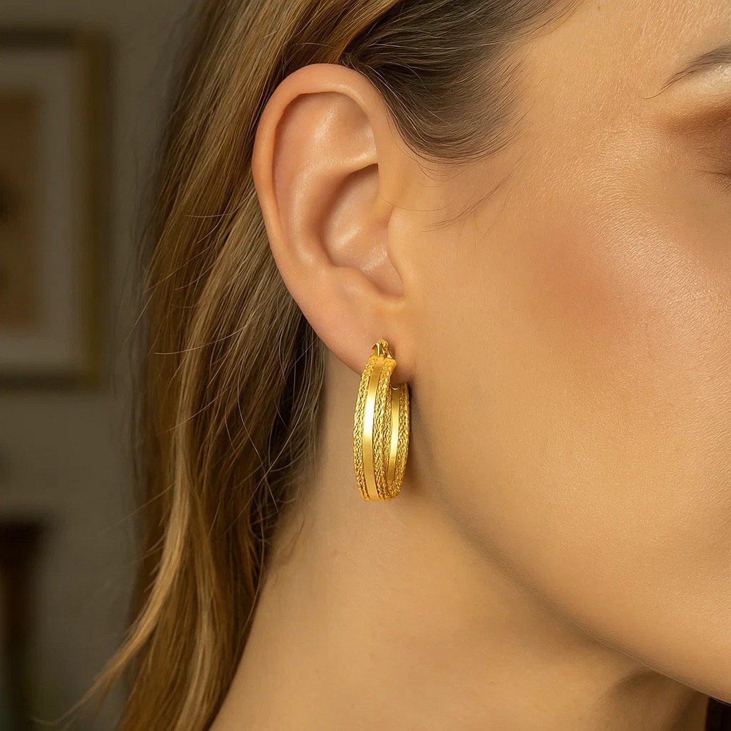 Elegant 14k yellow gold hoop earrings featuring a radiant sparkle design, perfect for any luxurious occasion.