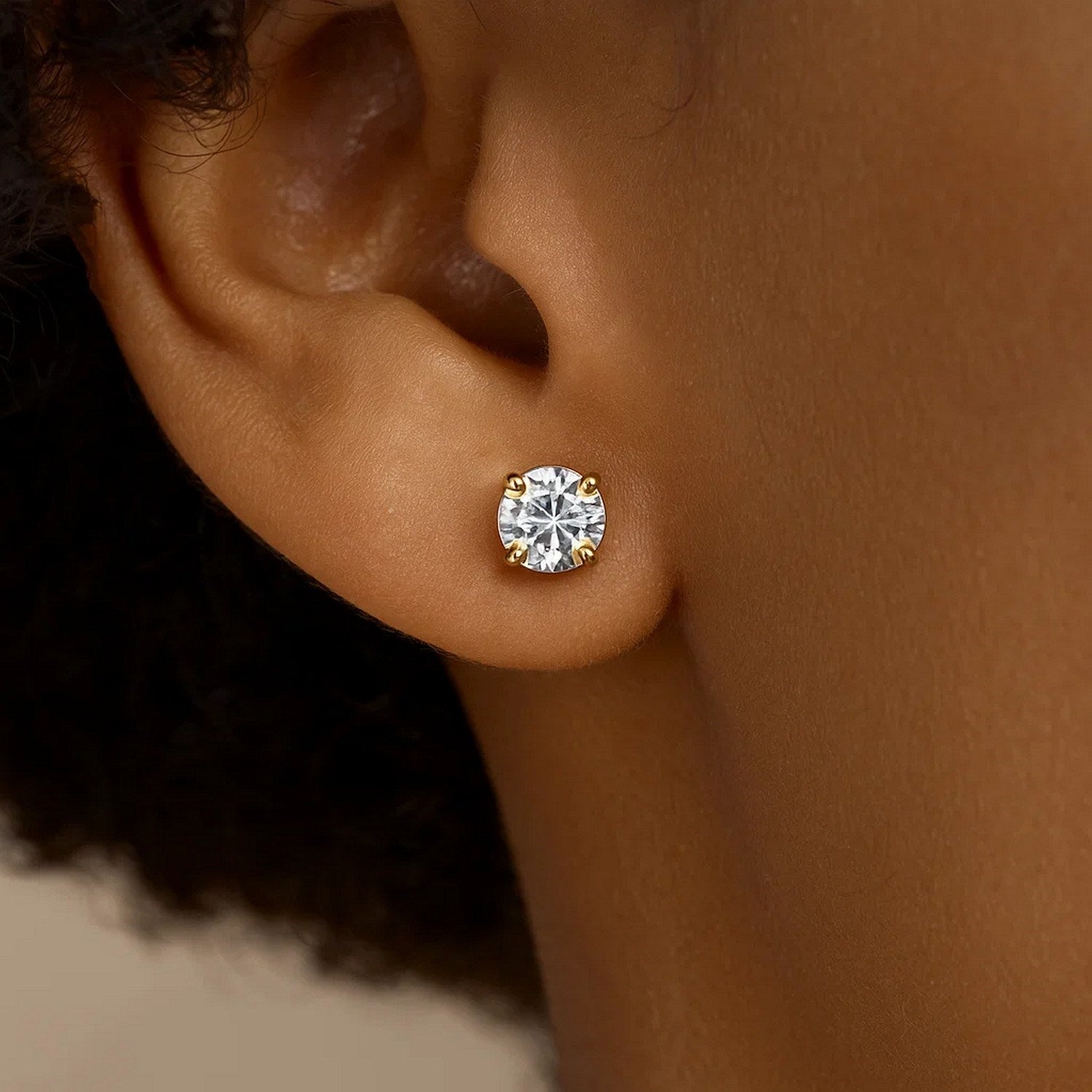 14k yellow gold stud earrings featuring elegant faceted cubic zirconia for a timeless, sophisticated look.