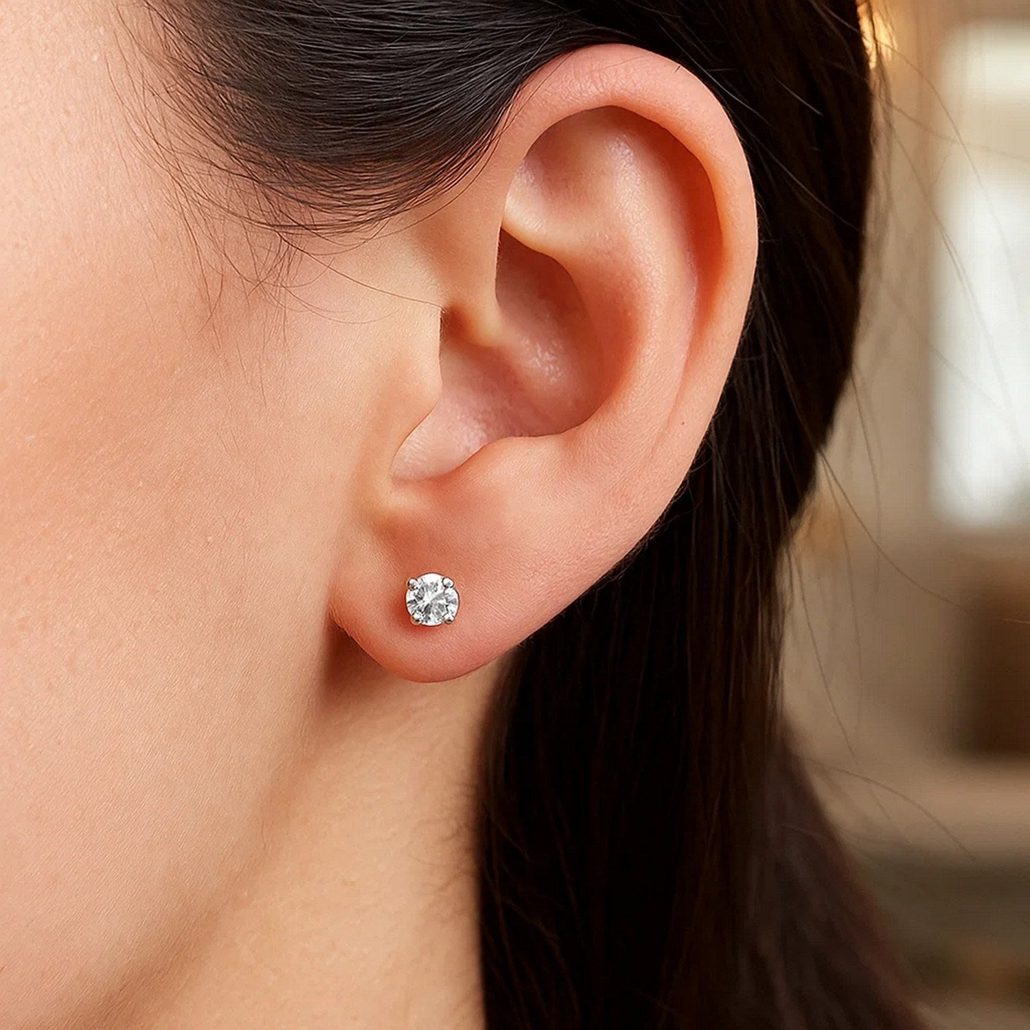 Elegant 14k white gold stud earrings featuring faceted white cubic zirconia for a timeless, luxurious look.