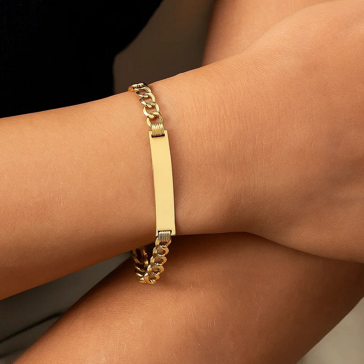14k yellow gold curb ID bracelet with modern chain design, showcasing elegance and luxury craftsmanship.